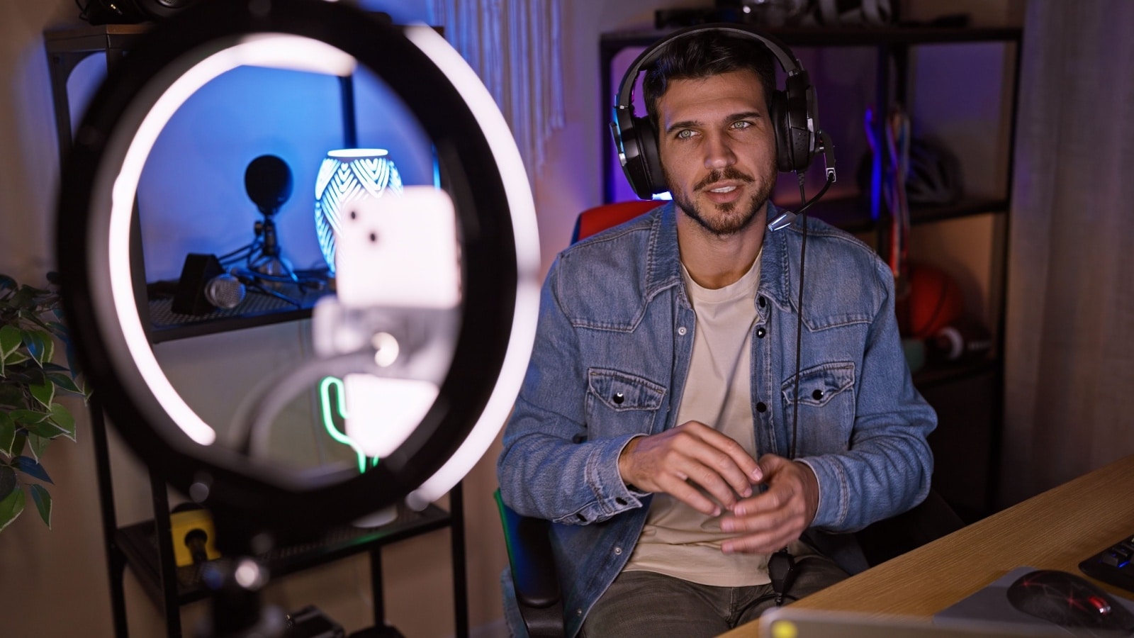 A man doing a livestream in front of a ring light. How much do Twitch streamers make?