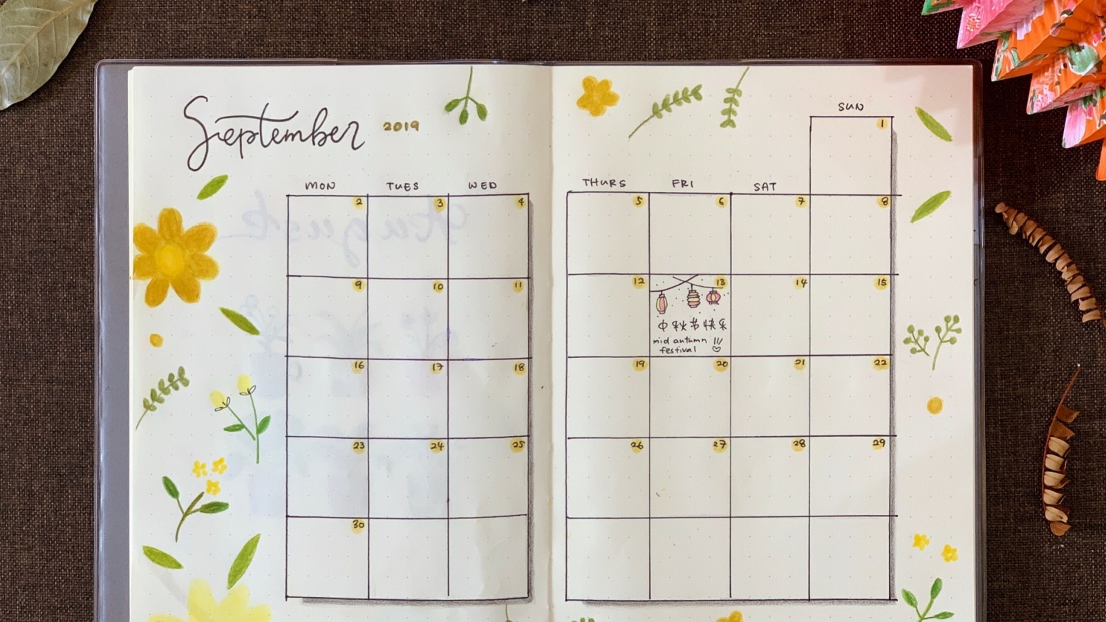 A bullet journal monthly spread showing the calendar in September.