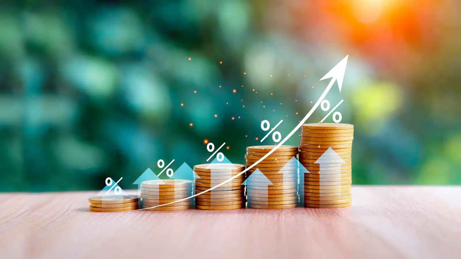 A graphic representing the magic of compound interest. Coins are stacked in sequentially higher columns, with an arrow curving up following their growth. 