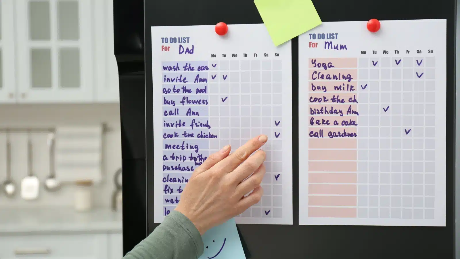 Making a list of household tasks pinned to the refrigerator. 