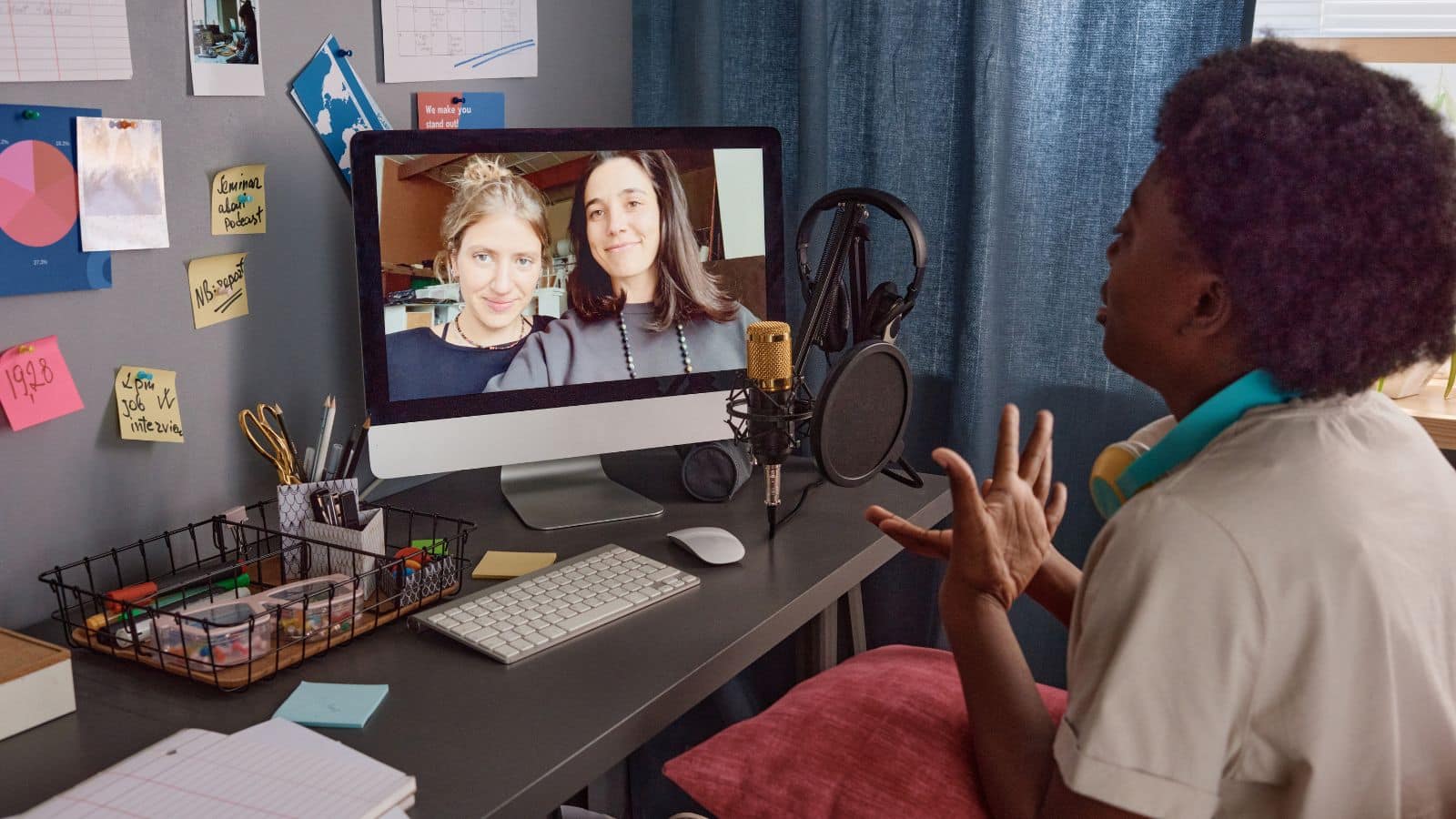A woman on a video call with friends to represent how to use Discord the messaging app.