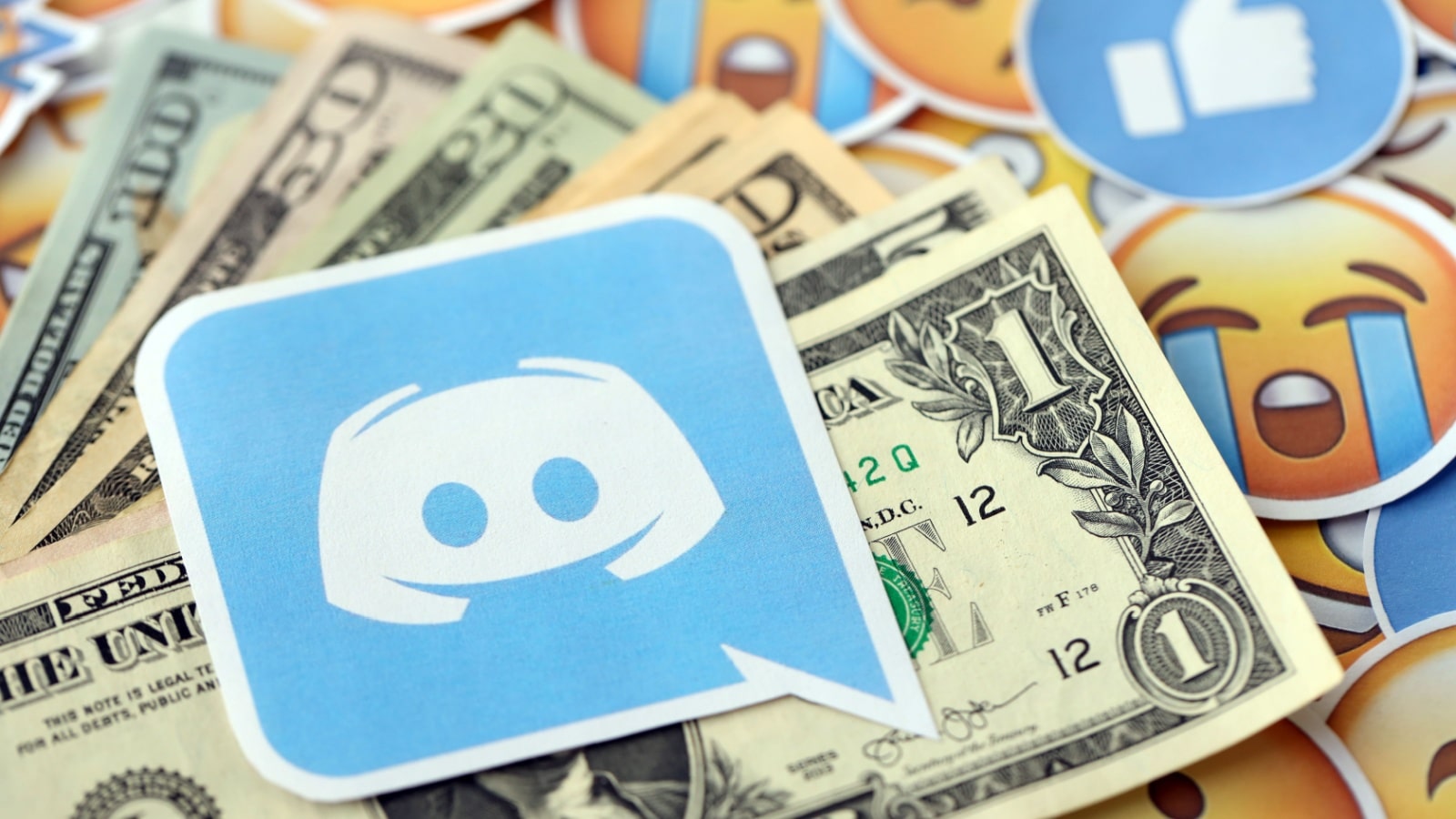 The Discord icon on top of money to represent financial services Discord bots. 