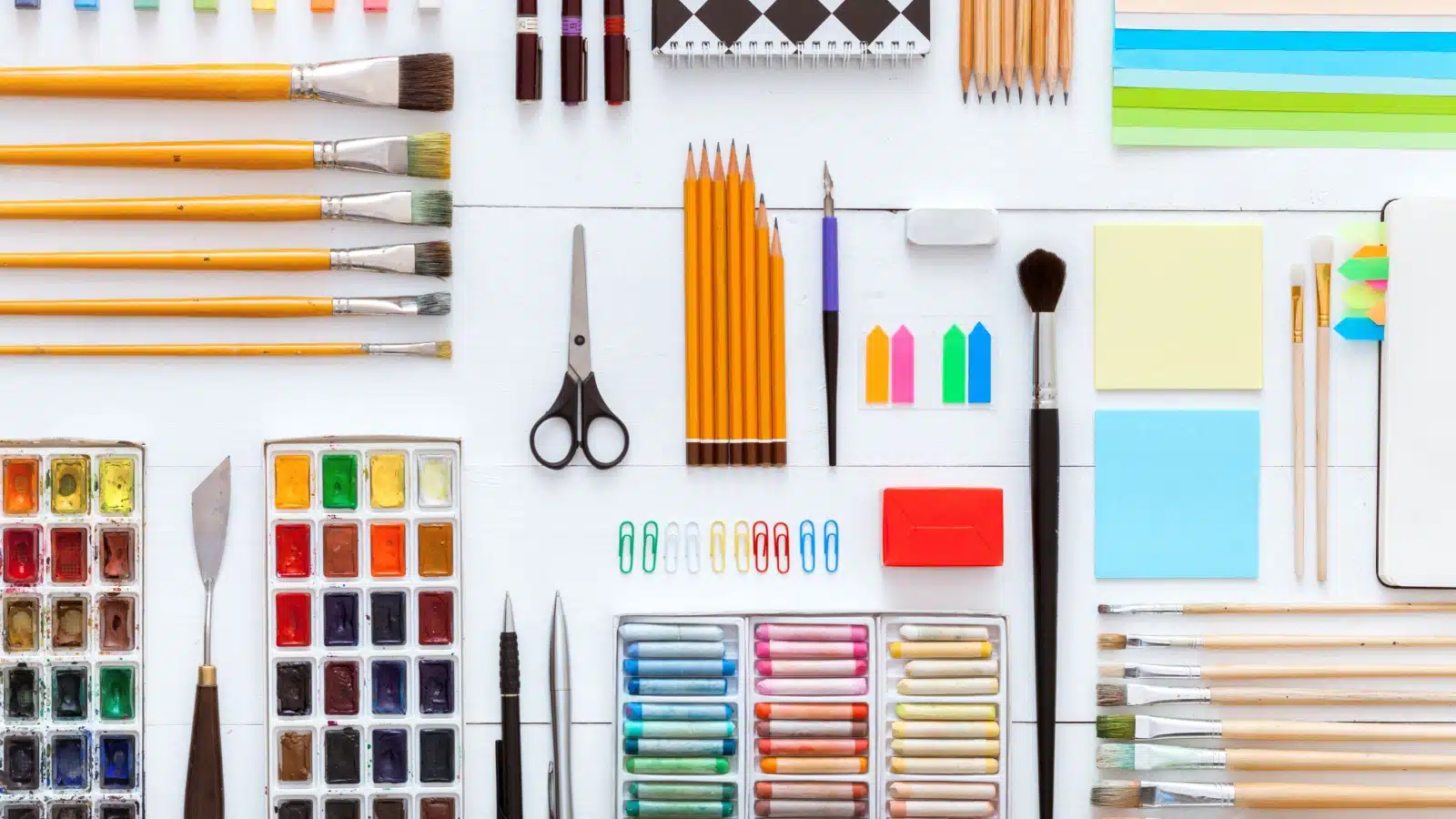A variety of art and office supplies you might need for beginner art journal supplies. 
