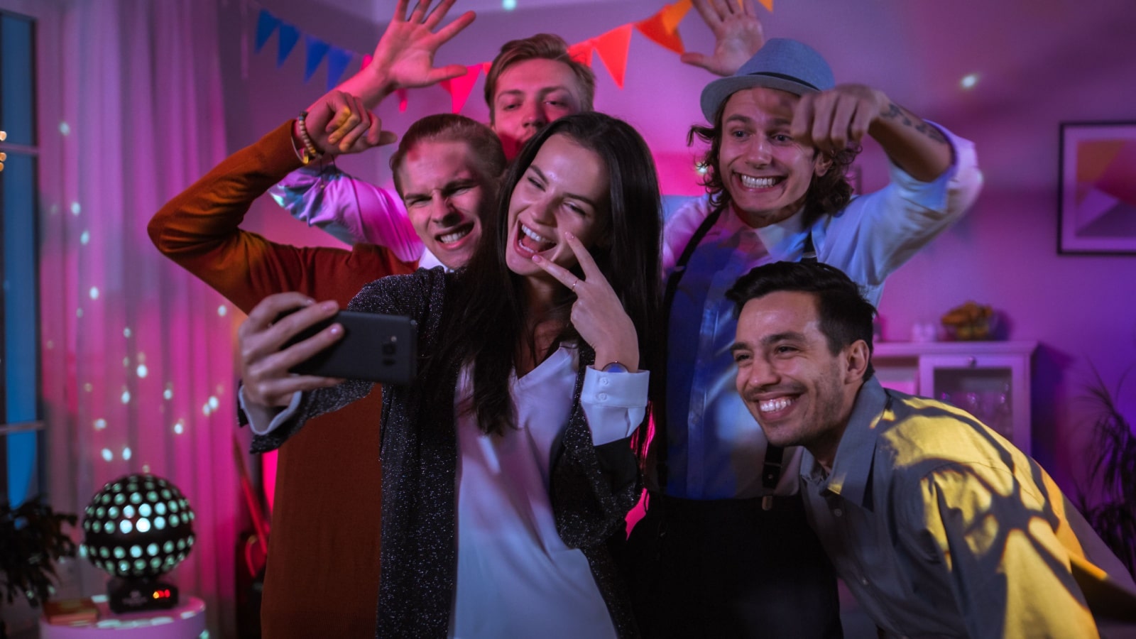 House party guests taking a selfie together.