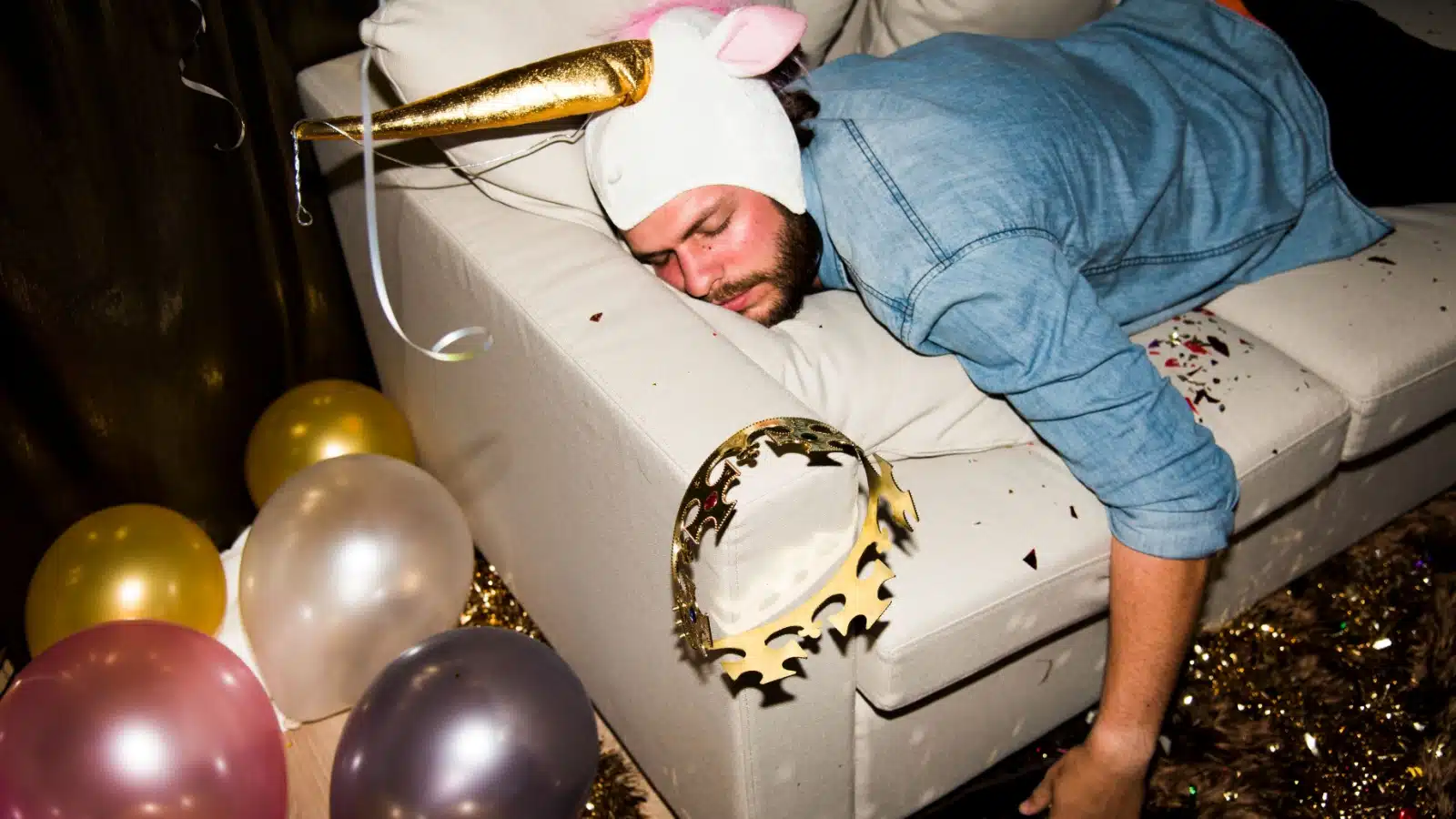 A man passed out on a couch at a party to represent the biggest party fouls.