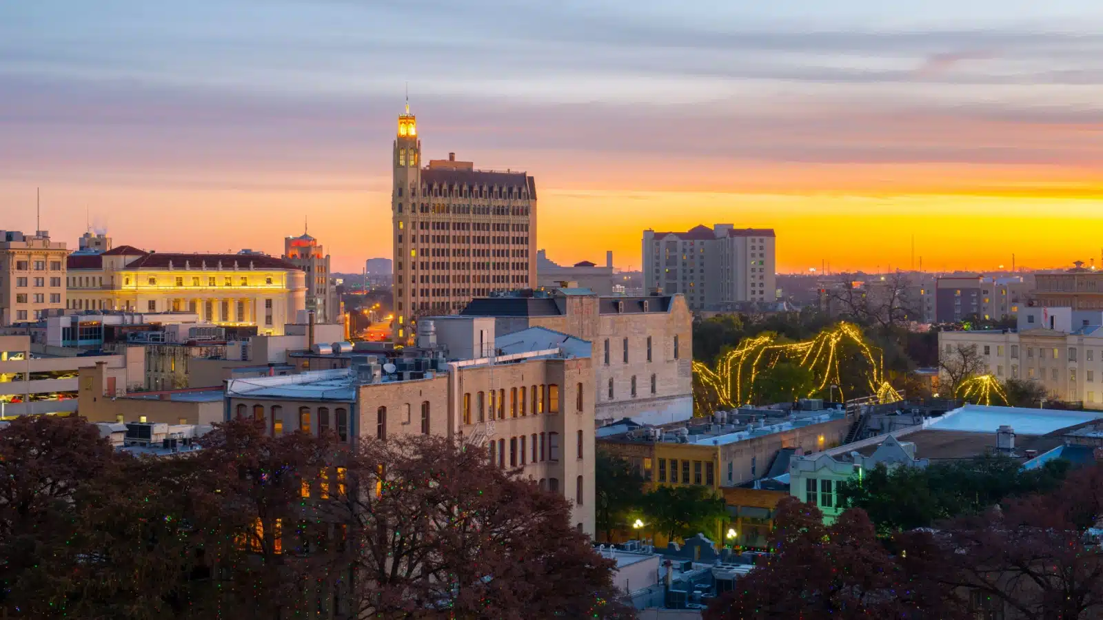 A view of downtown San Antonio at sunset with the Emily Morgan hotel. 