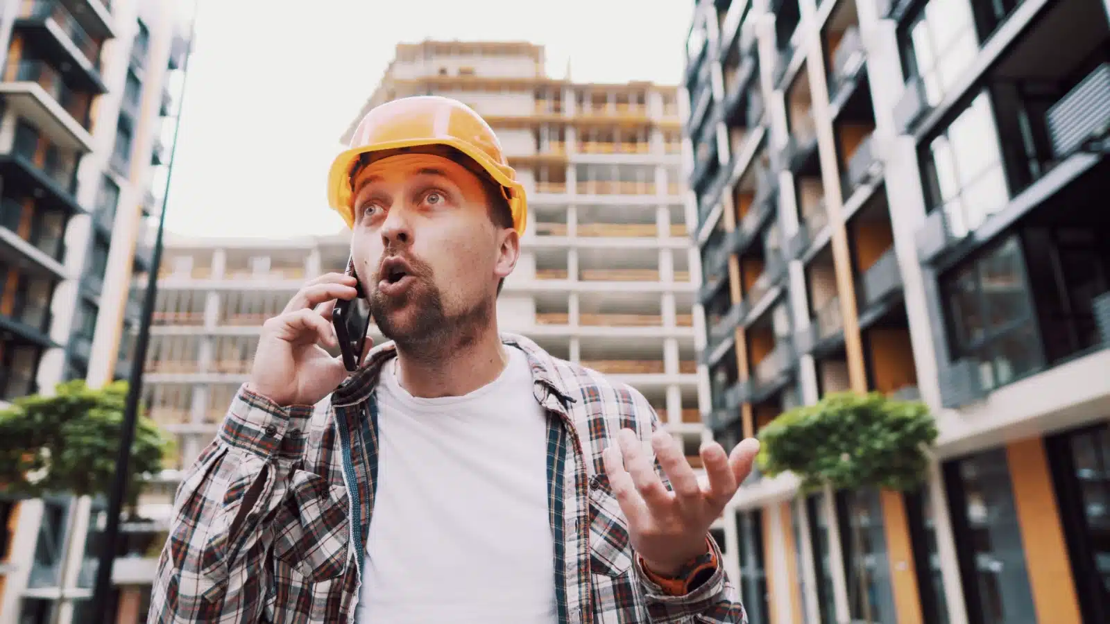 An angry contractor yelling on the phone. 