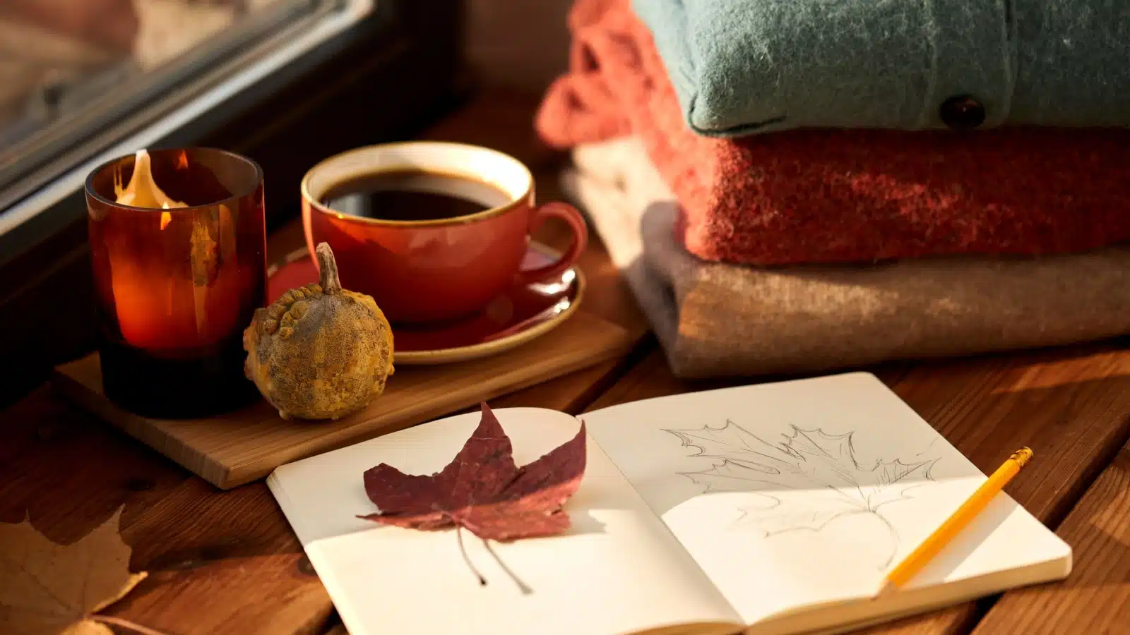 Seasonal art journal ideas like sketching leaves in the fall.