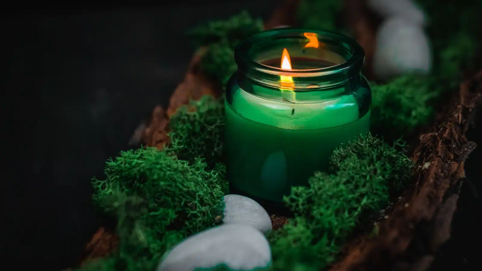 A lit green candle, as green often represents wealth and prosperity.
