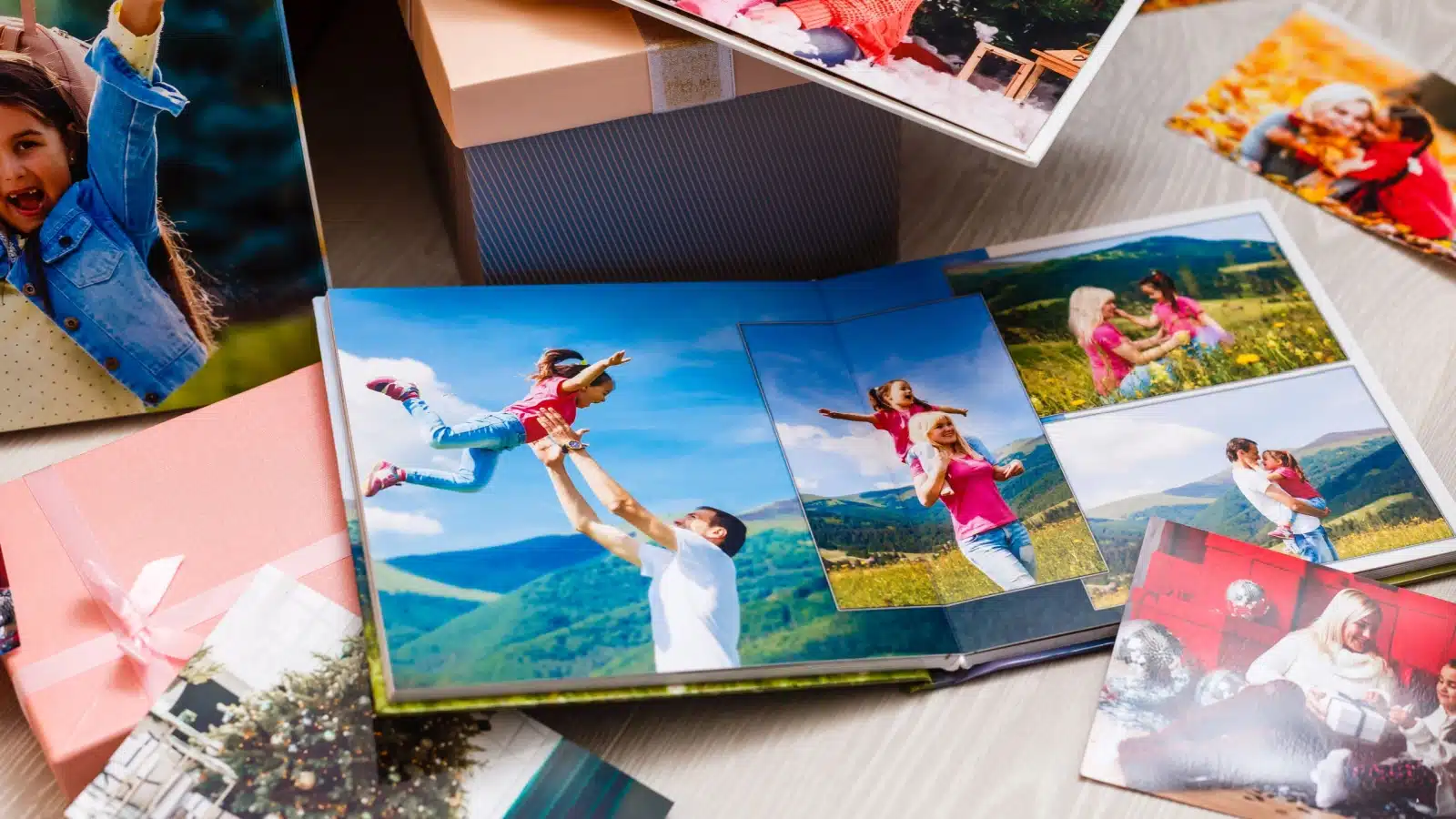 A photo album surrounded by a vareity of pictures.