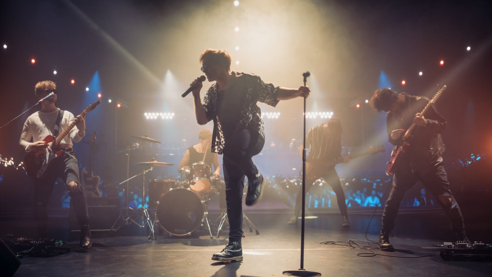 A rock band singing to represent songs about monsters.