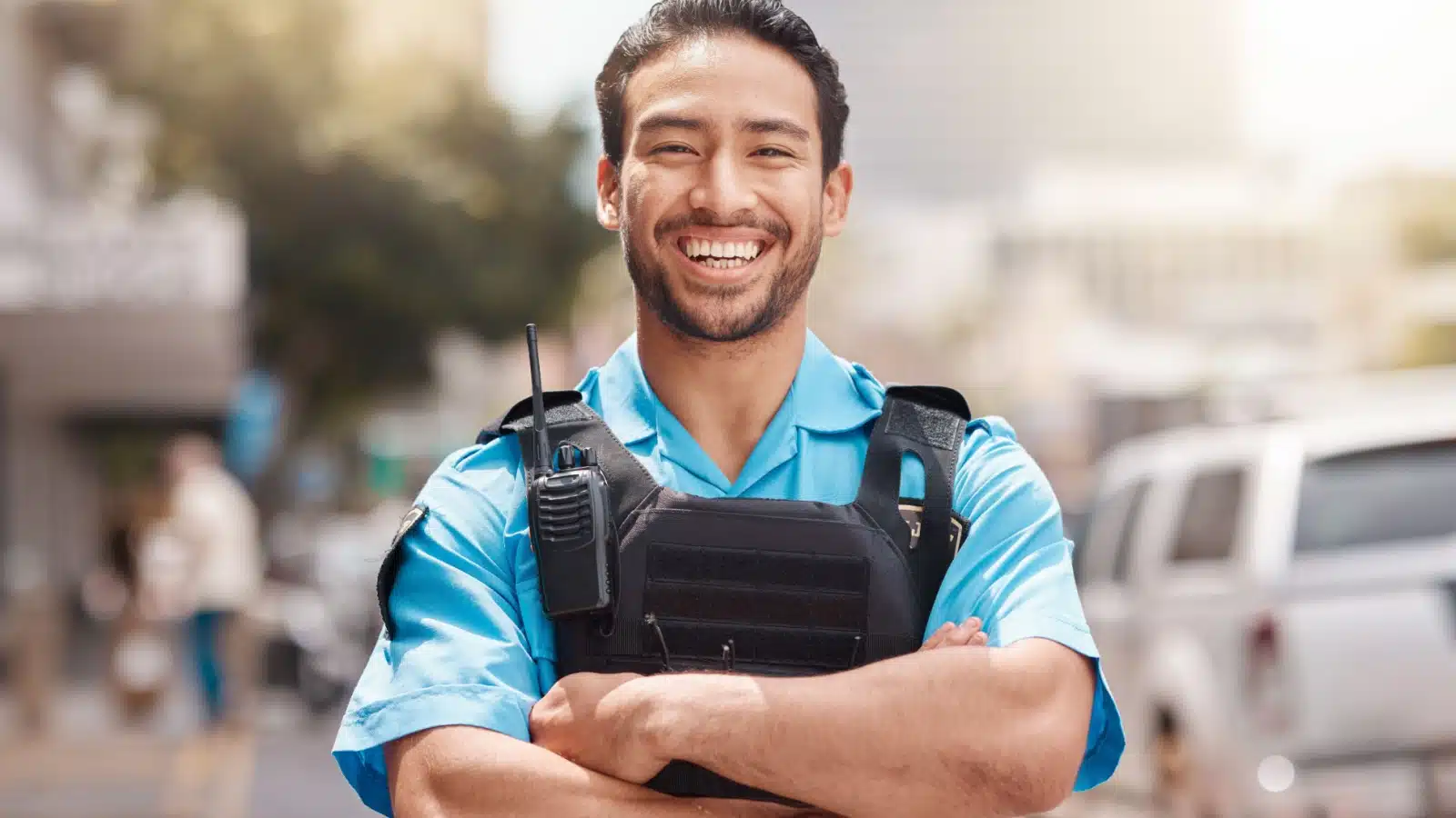 A smiling security guard happily keeping law and order in a good society.