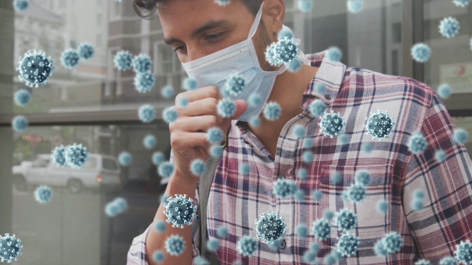 A man wearing a medical mask coughs. He's surrounded by large graphics representing germs and things COVID changed.