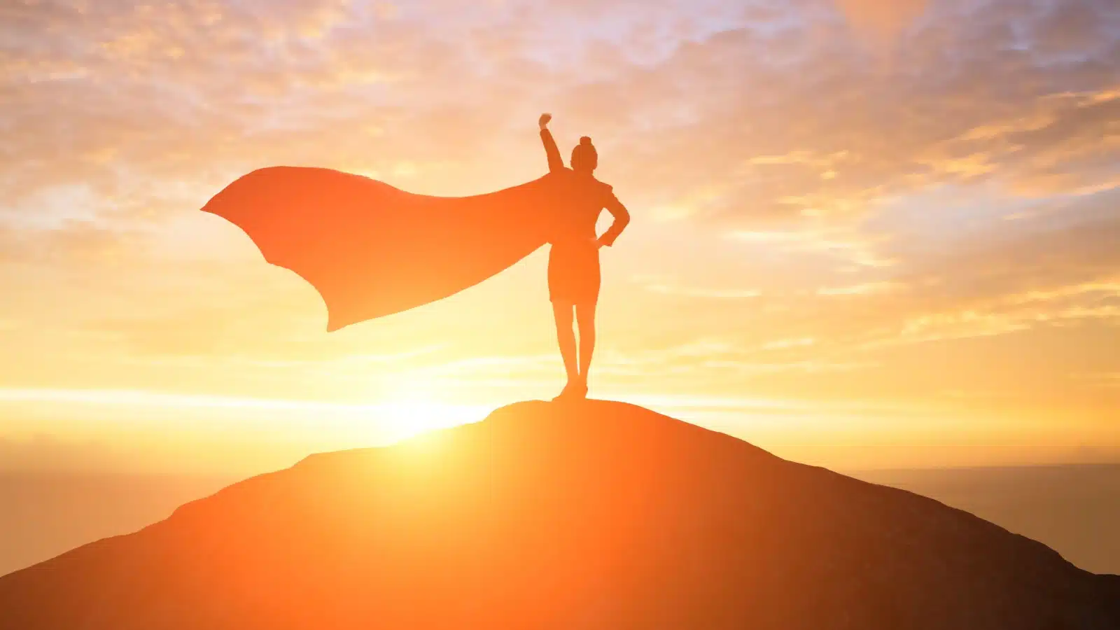 A silhouette of a woman with her arm out in a superhero stance wearing a flowing cape to represent the lawful good ideals.