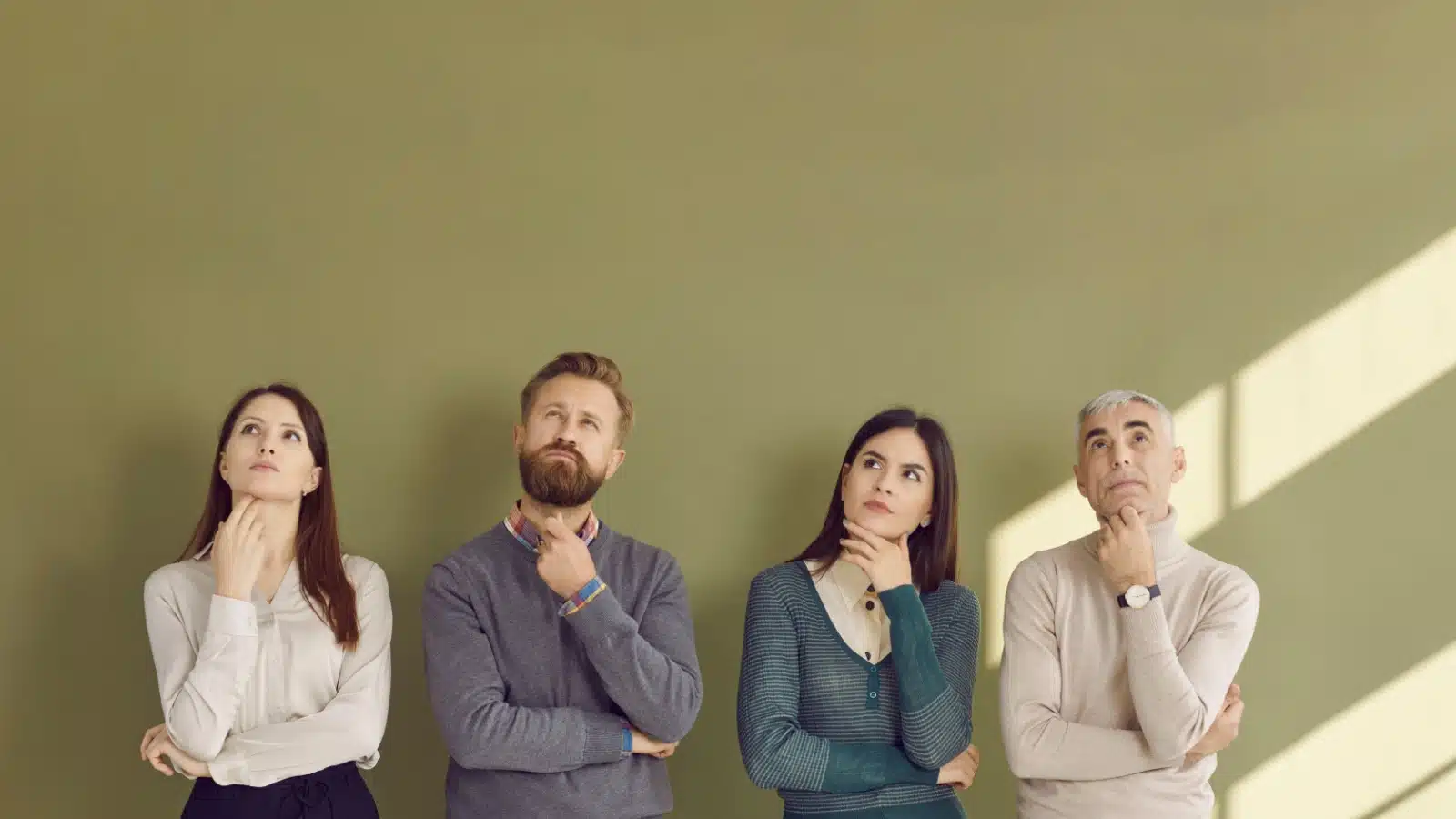 Four unsure people with thoughtful/thinking expressions.