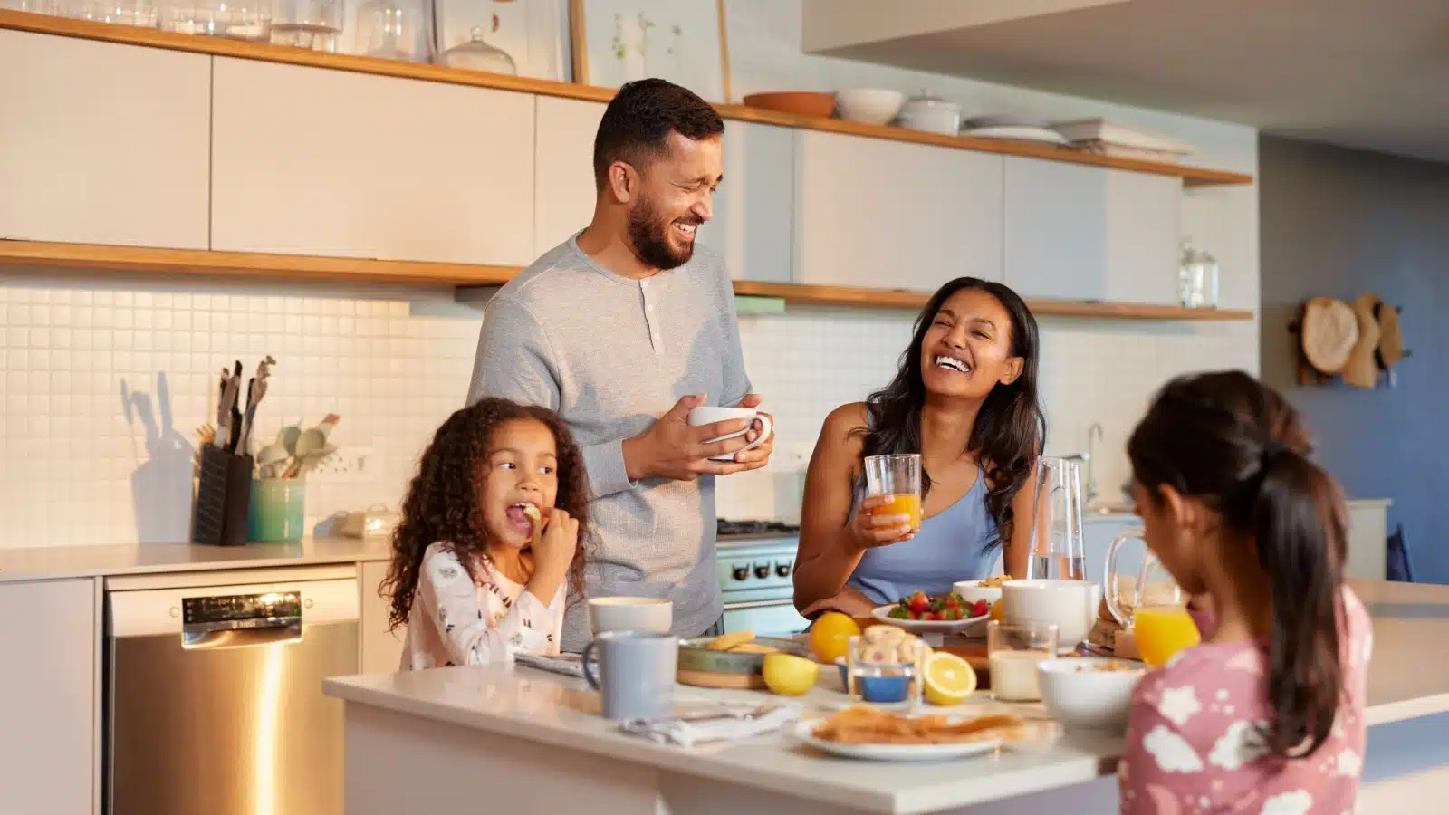 A happy family enjoys breakfast together in the morning.