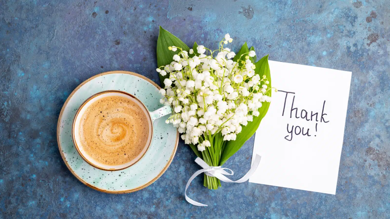 A thank you note with little flowers and a cup of coffee.