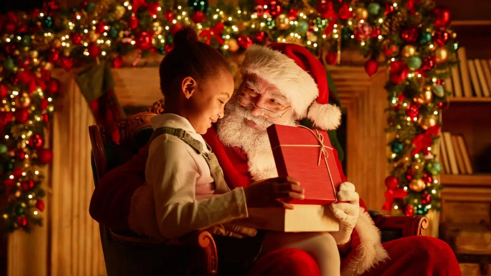 A child visiting with Santa Claus to represent the Christmas spirit. 