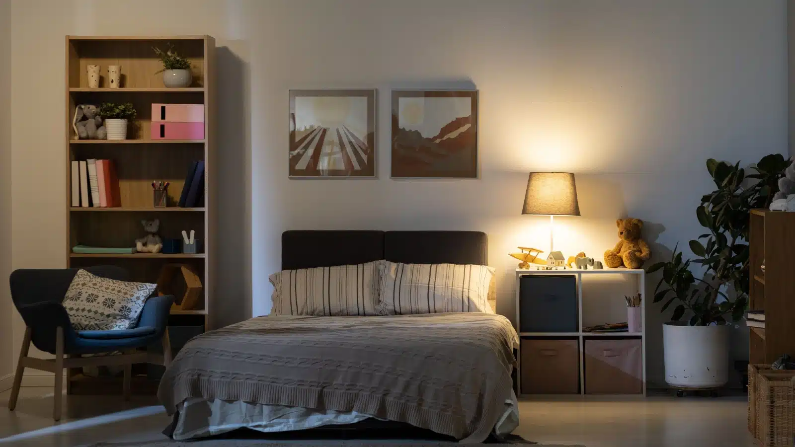 A cozy bedroom light by a warm bedside table lamp.