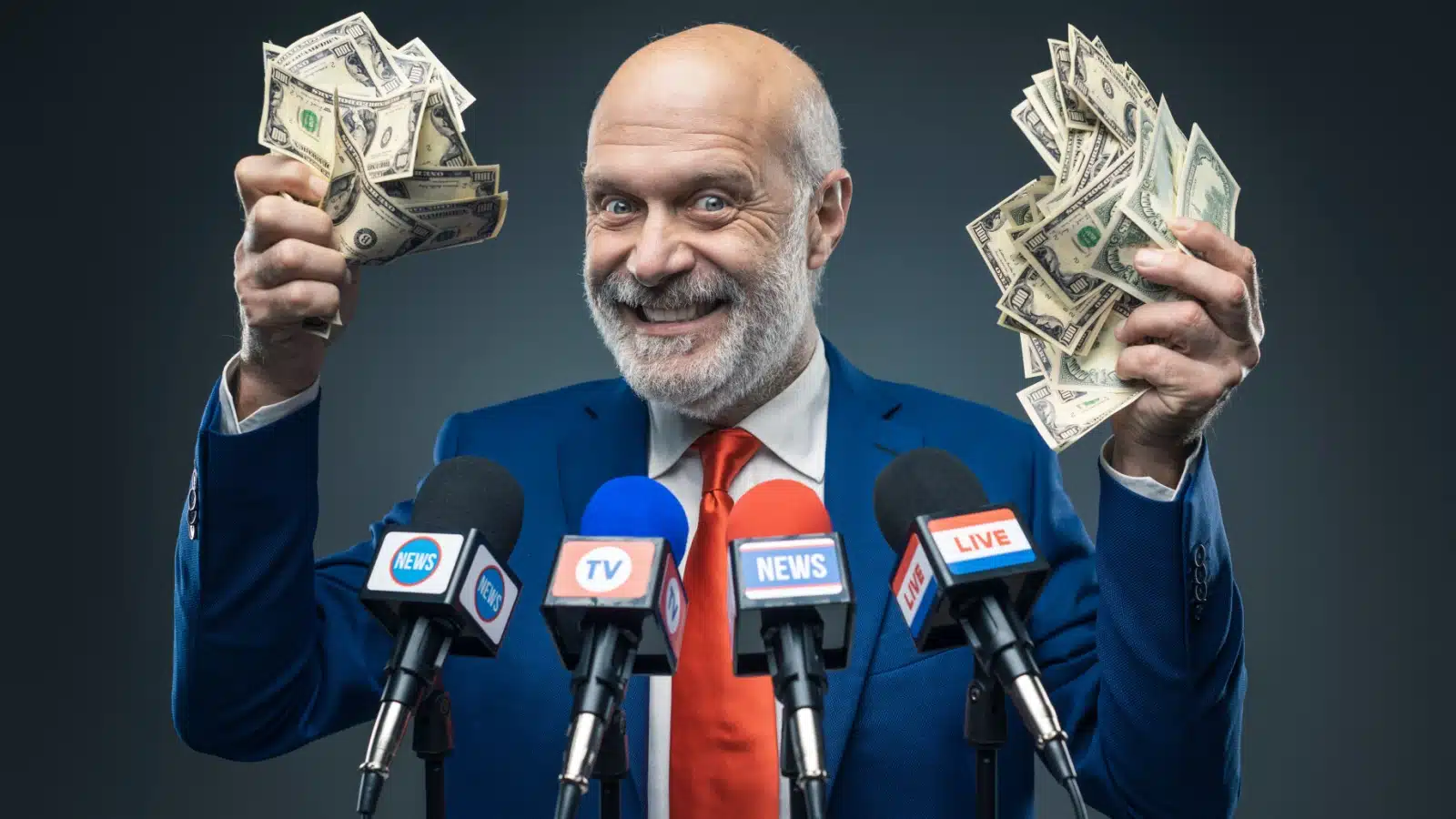 A greedy man holds fistfuls of dollars while standing in front of news media microphones, to represent why media companies love rage bait. 