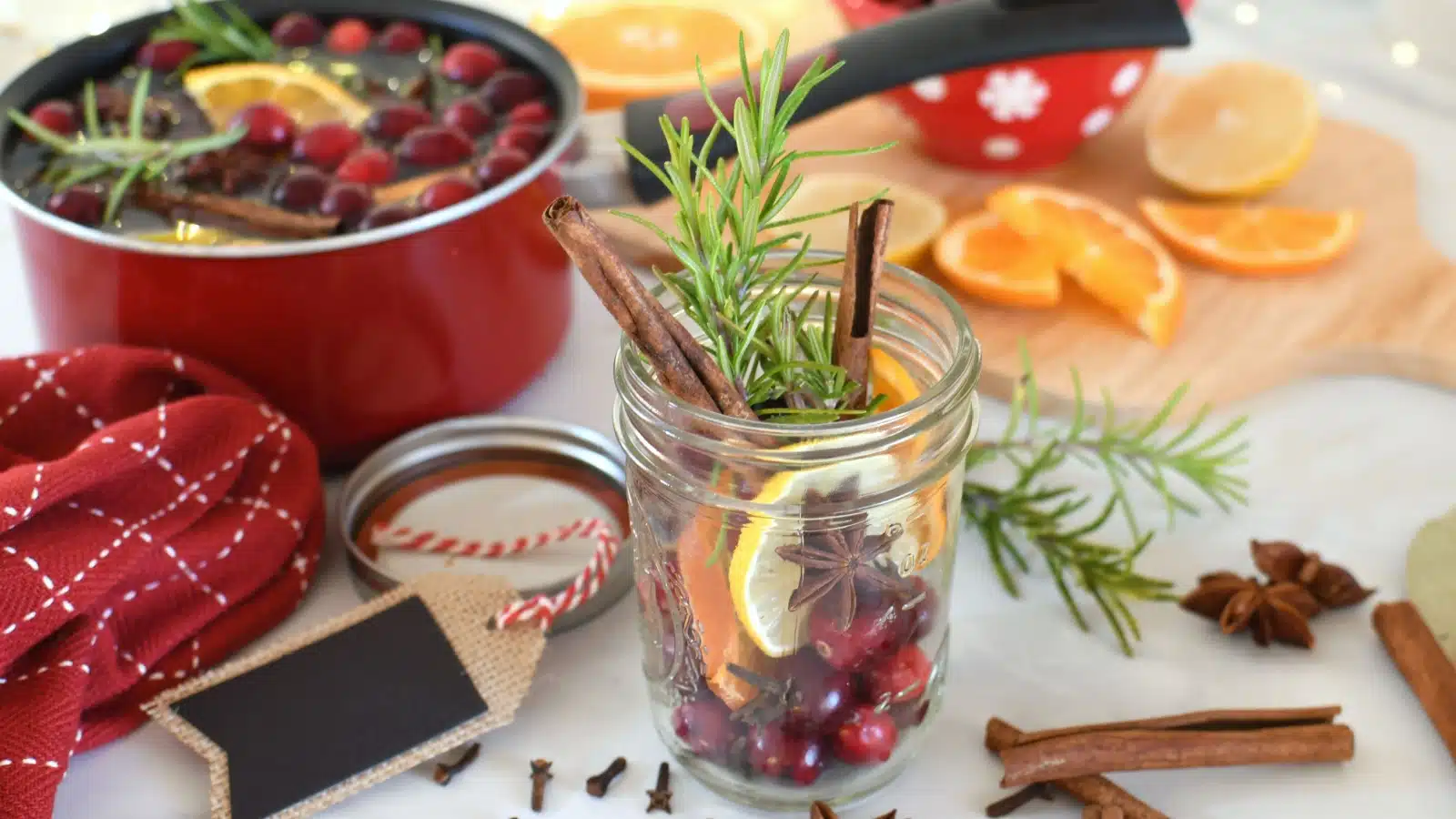 A home-brewed concoction featuring cranberry, pine, citrus, clove, and cinnamon to make a home smell like Christmas.