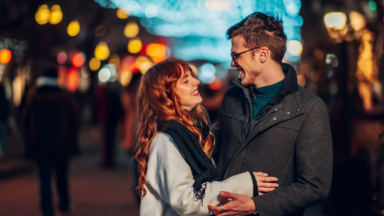 A happy couple enjoys a date in the winter.