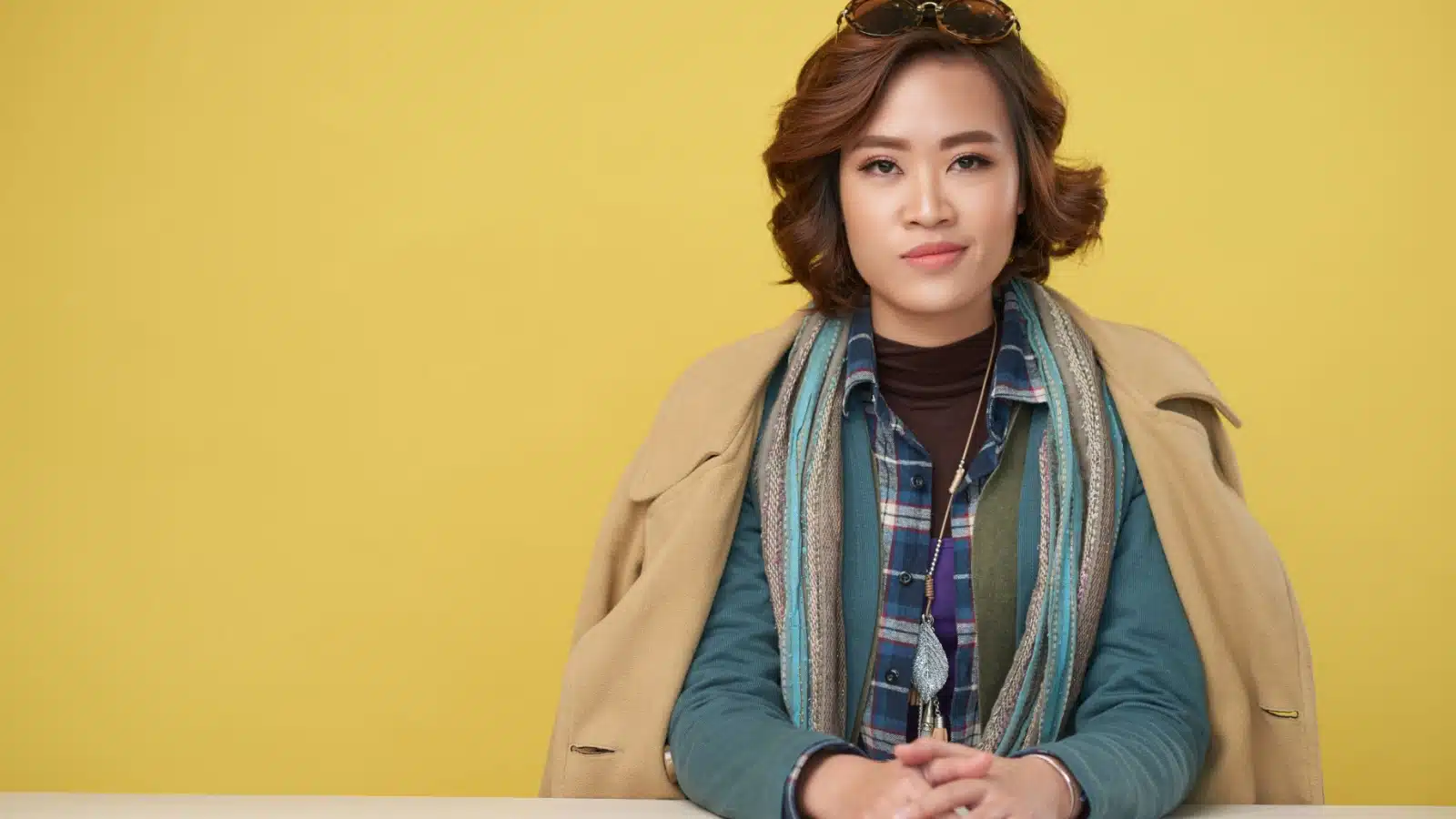 A woman wearing layered clothing to stay warm during the winter.