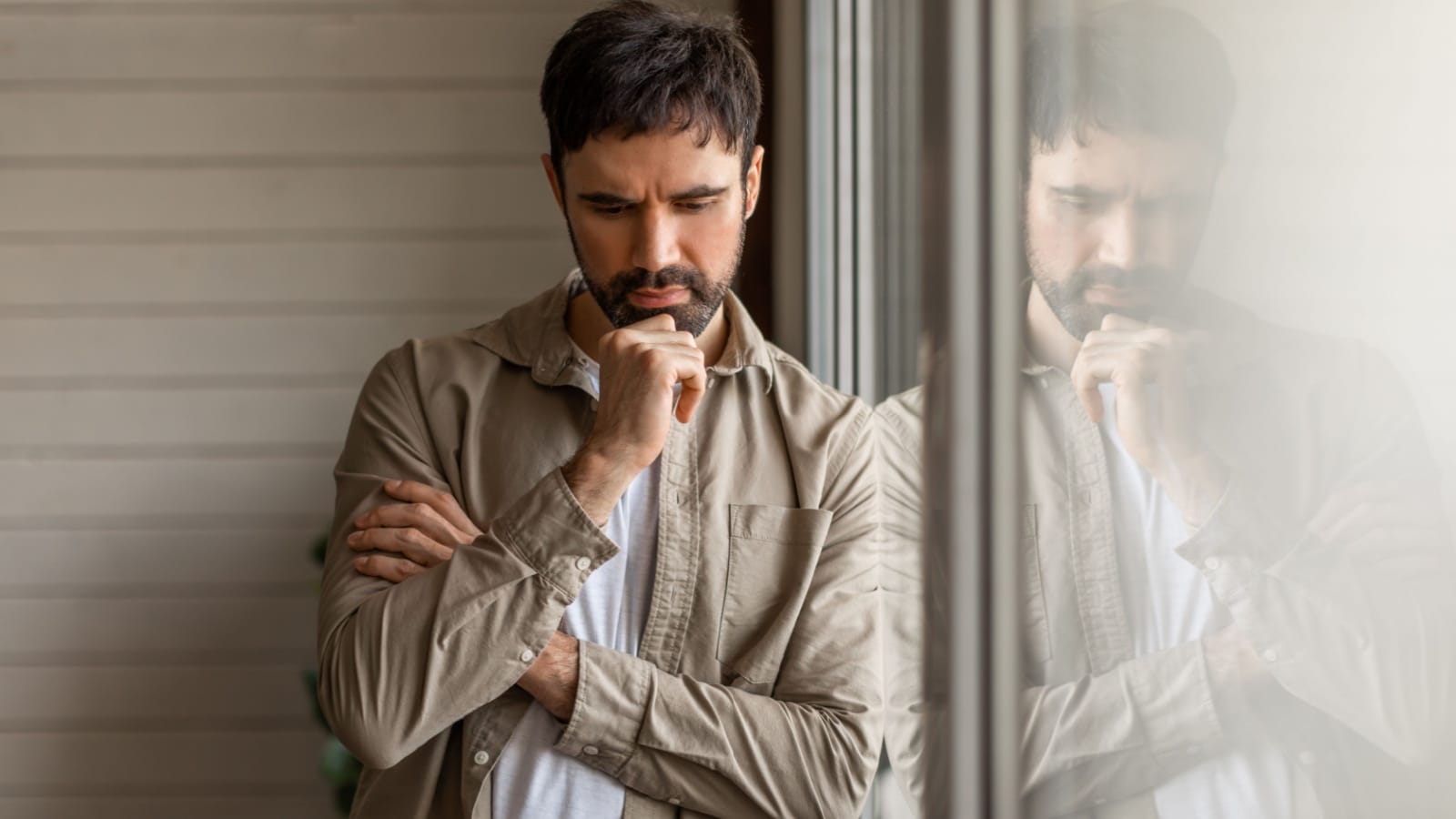 A pensive man deep in thought, as if he's having an existential crisis.