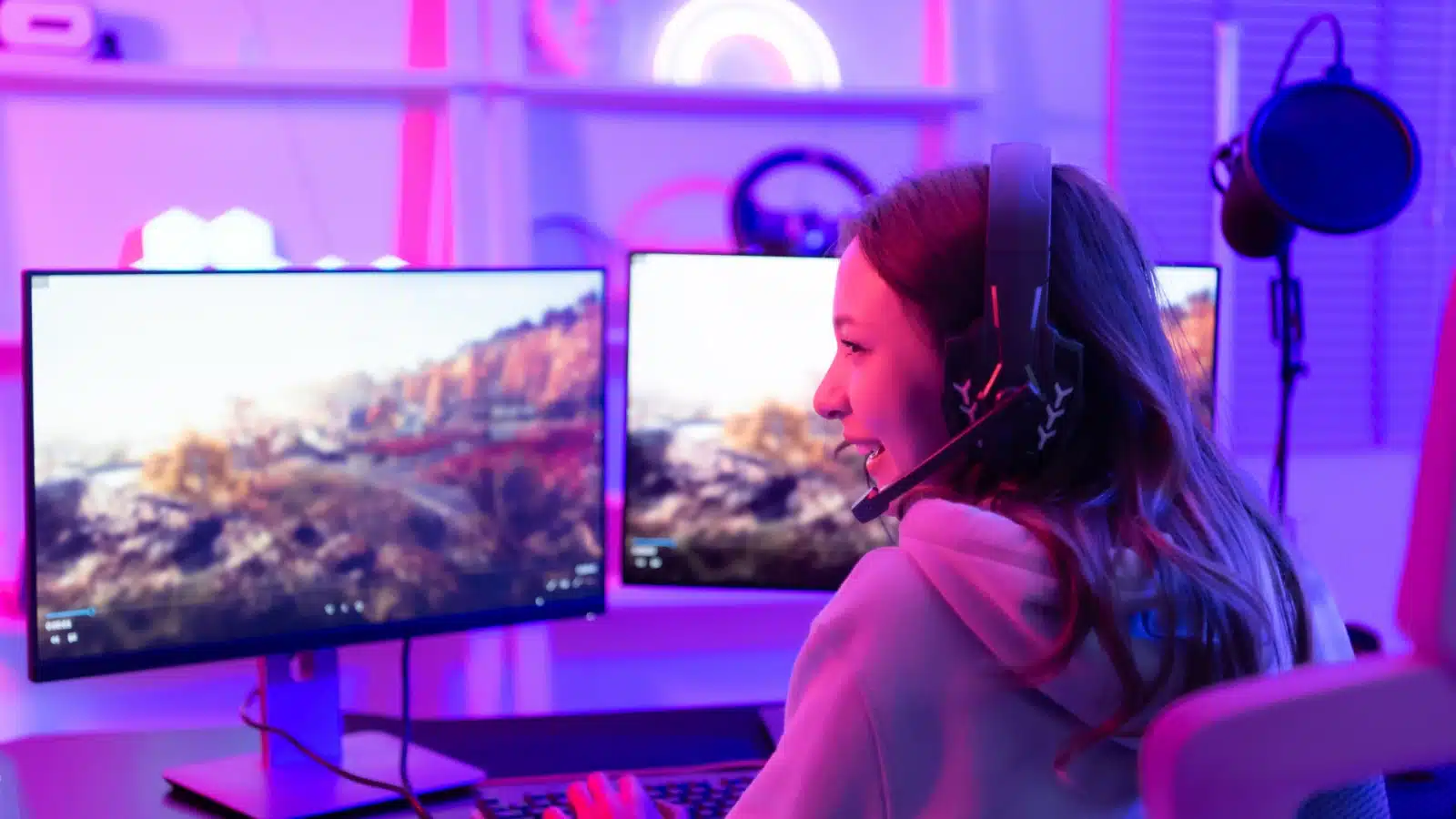 A woman livestreams her video game play to represent female Twitch streamers.