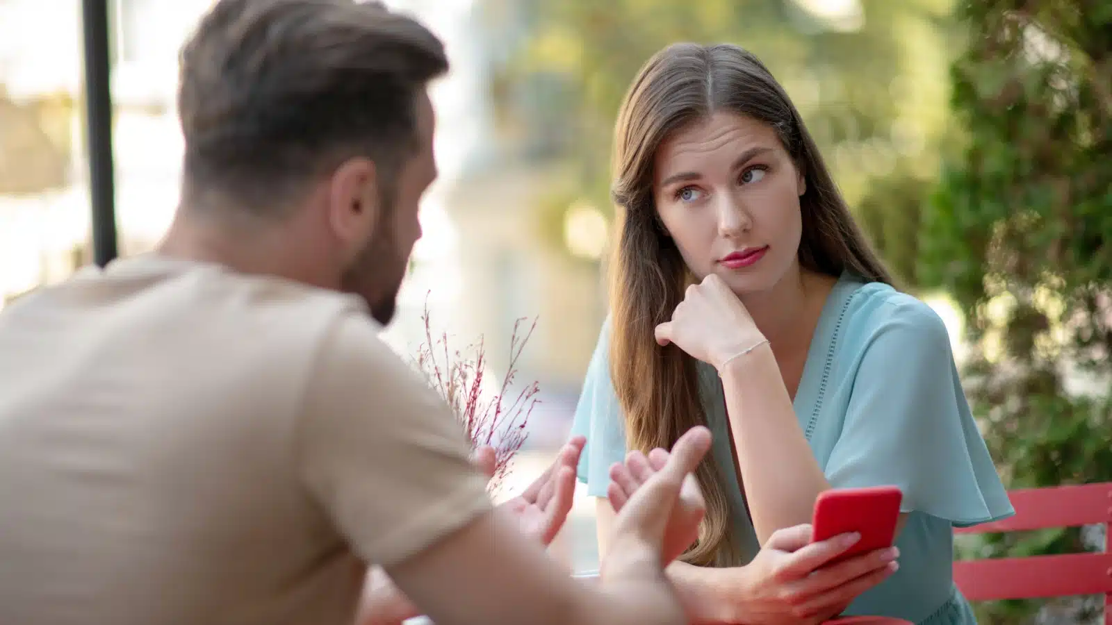 A woman looks repulsed by her date to represent unattractive hobbies.