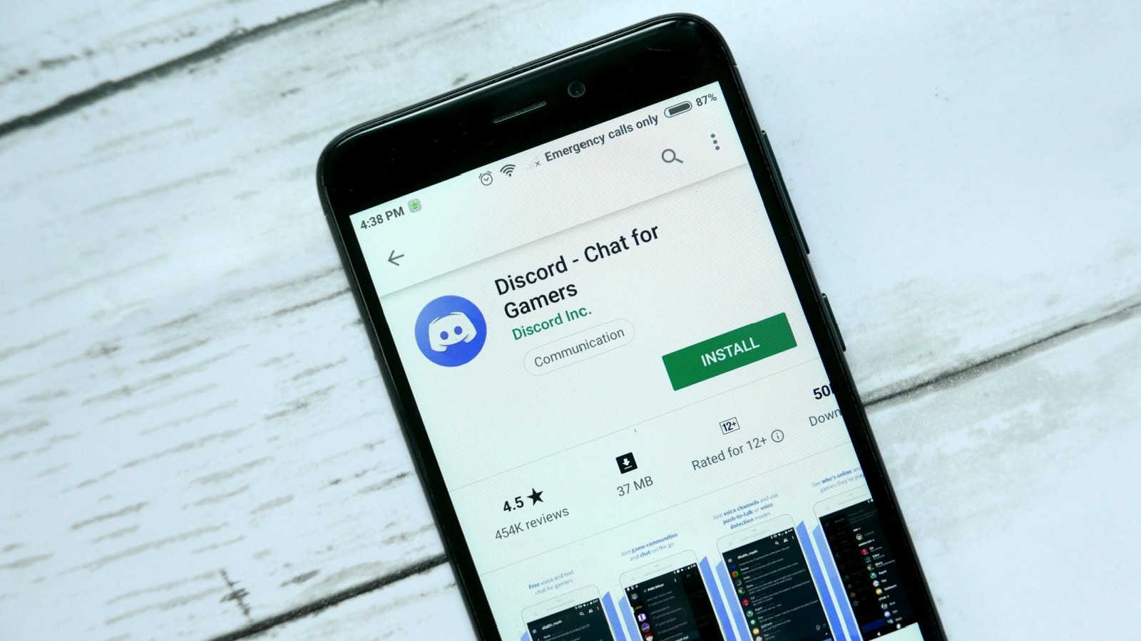 An app store on a cell phone with the user ready to download Discord messaging app.