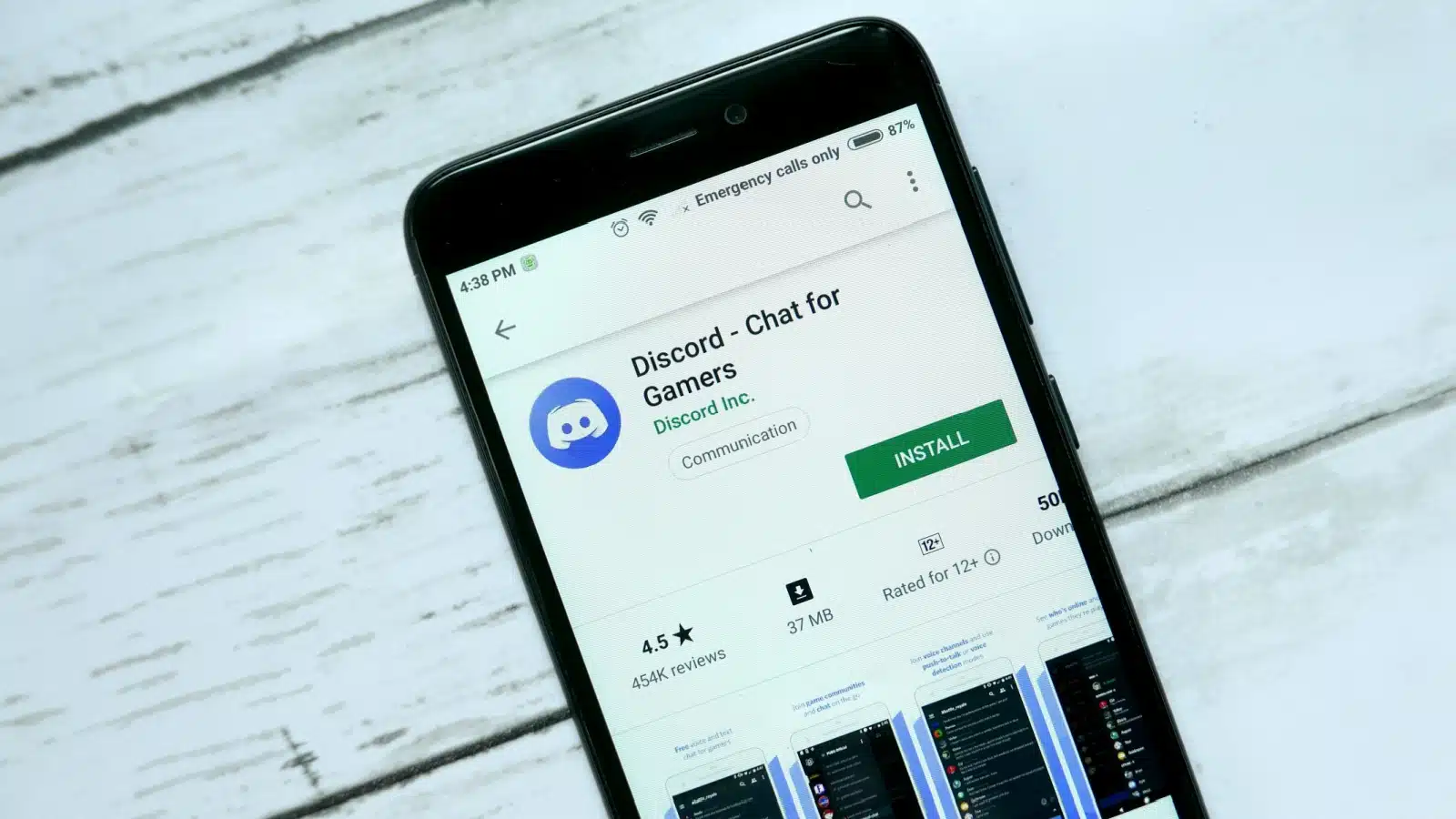 An app store on a cell phone with the user ready to download Discord messaging app.