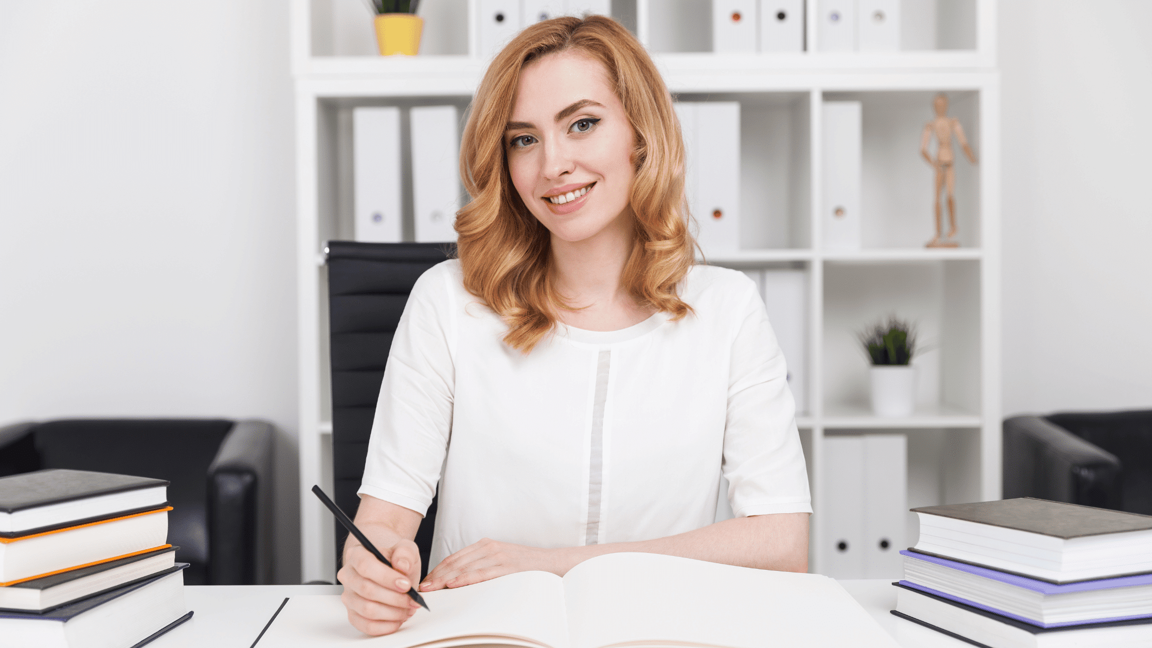 Woman writing at a desk to represent rising action