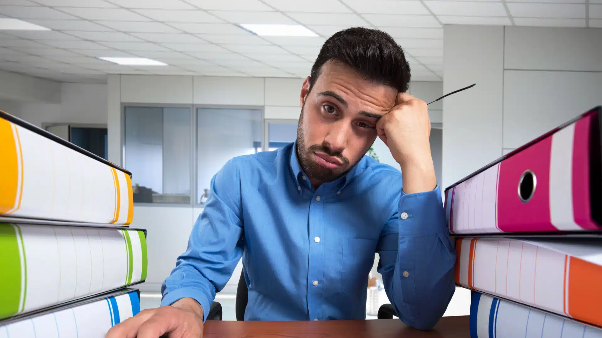 man at work looks really bored and unhappy