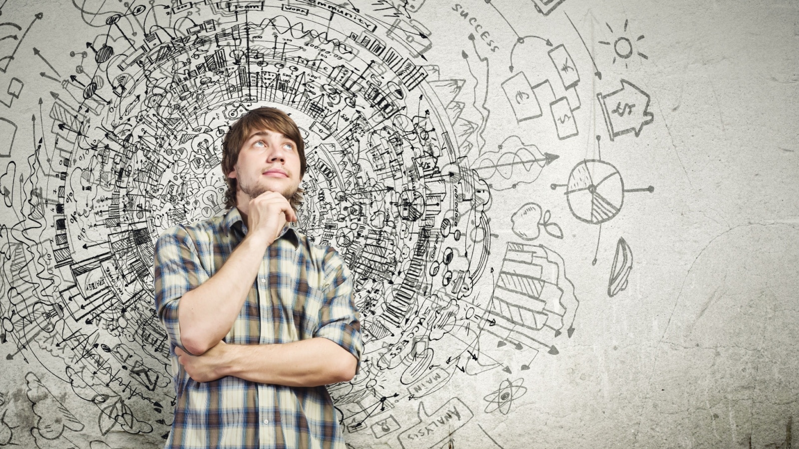 A young man thinking with a busy circle around him representing all the different thoughts and desires. He's contemplating his life goals, and whether having children is a part of them.