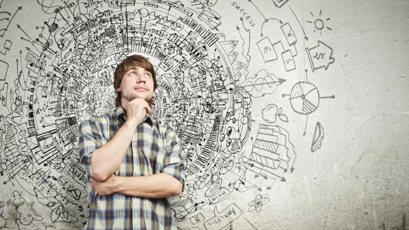 A young man thinking with a busy circle around him representing all the different thoughts and desires. He's contemplating his life goals, and whether having children is a part of them.