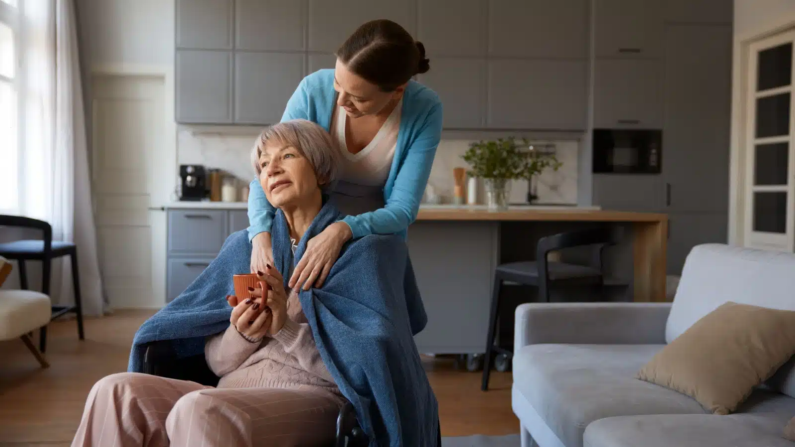 A woman takes care o her elderly mom.