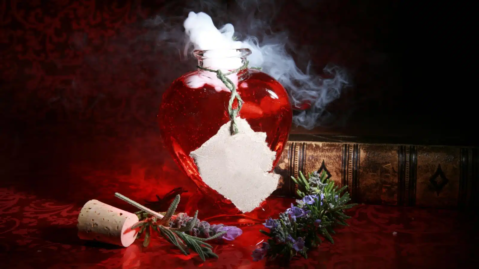 A pretty red love potion to represent the Witch's Book of Love Spells review.