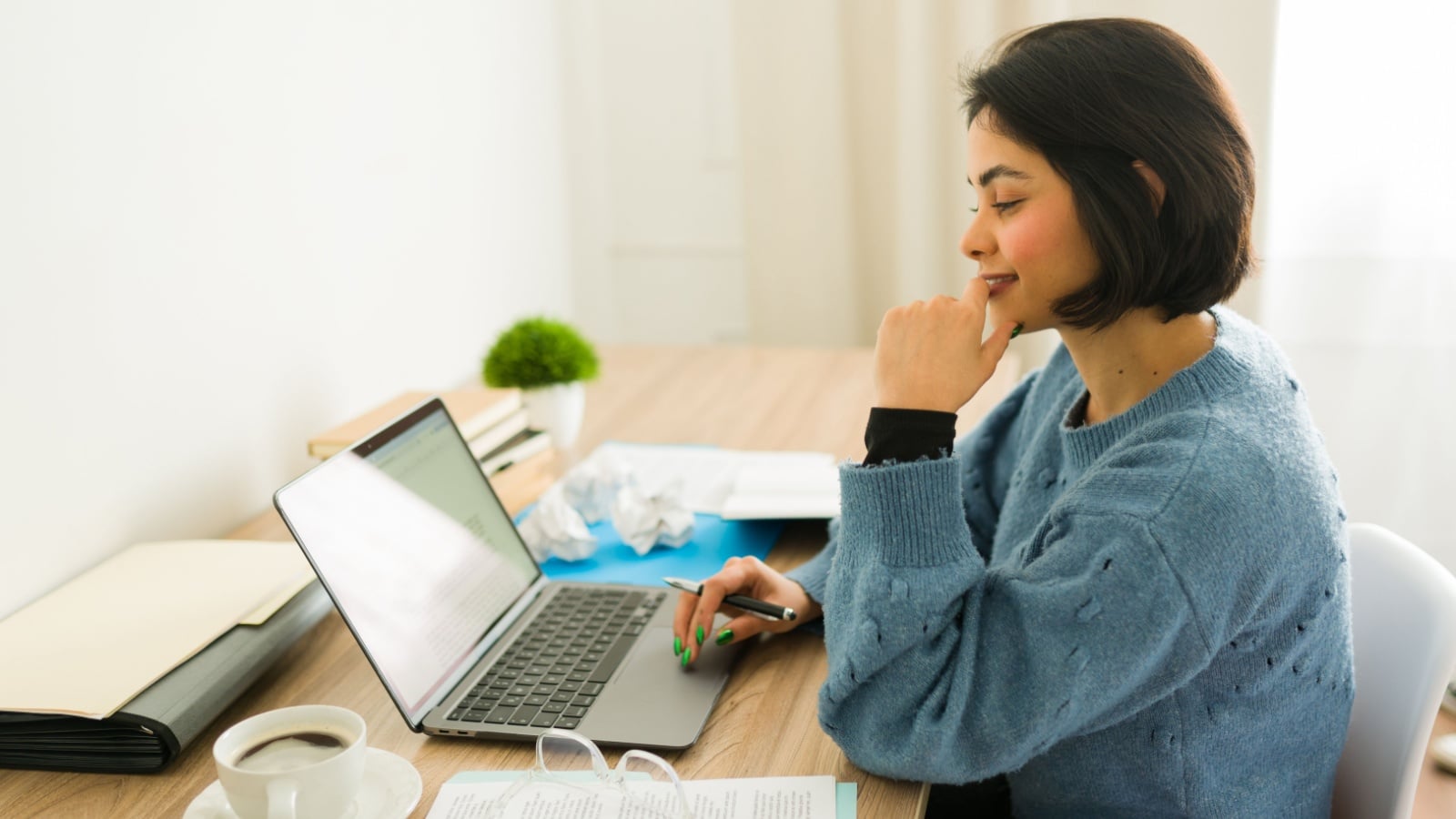 An author at her laptop to represent writing a rising action sequence in a story.