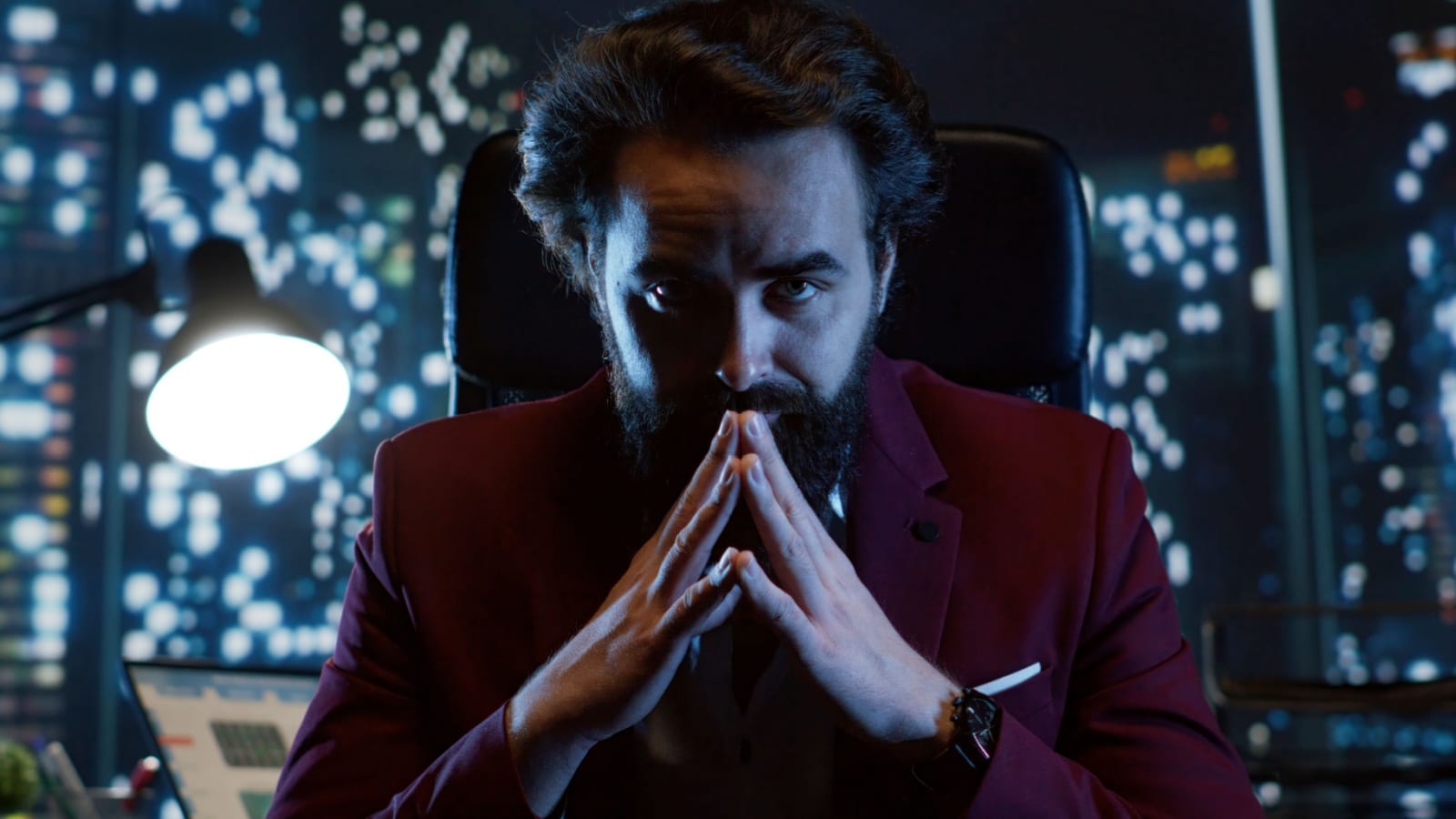 A rich, evil looking business man sitting in a dark room, plotting, to represent things that shouldn't be legal.