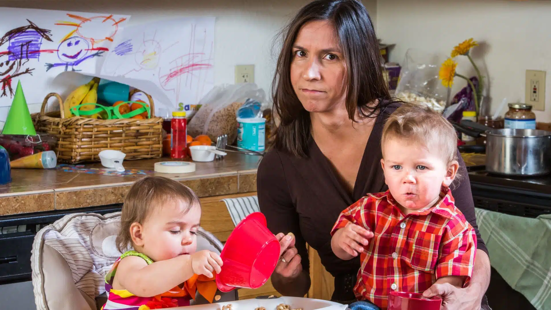 stressed mom with two young kids