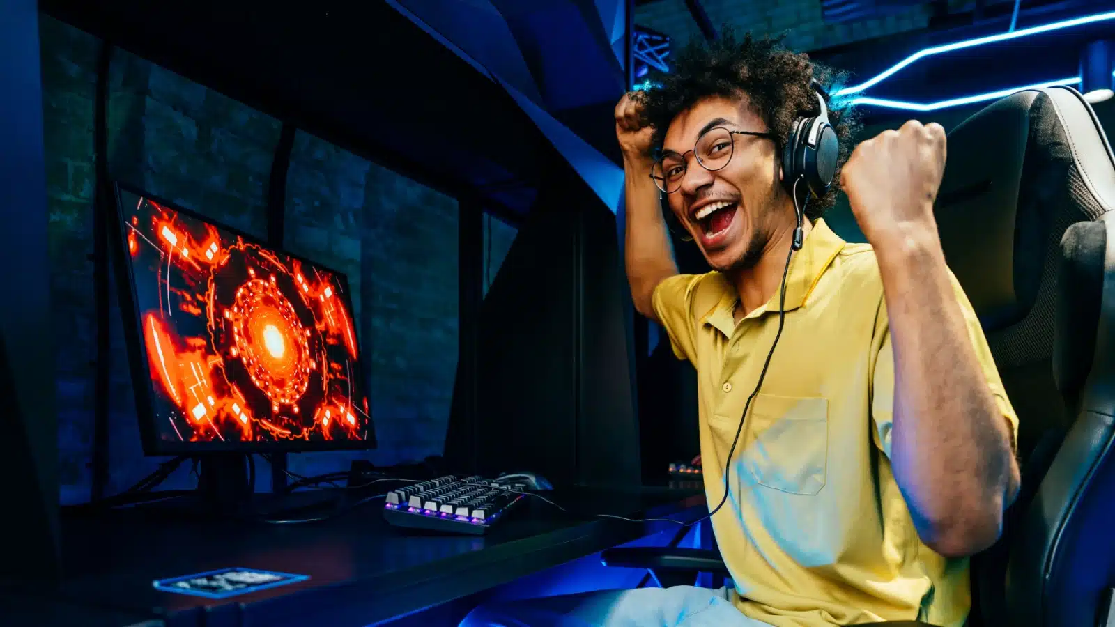 A gamer celebrates winning while streaming.