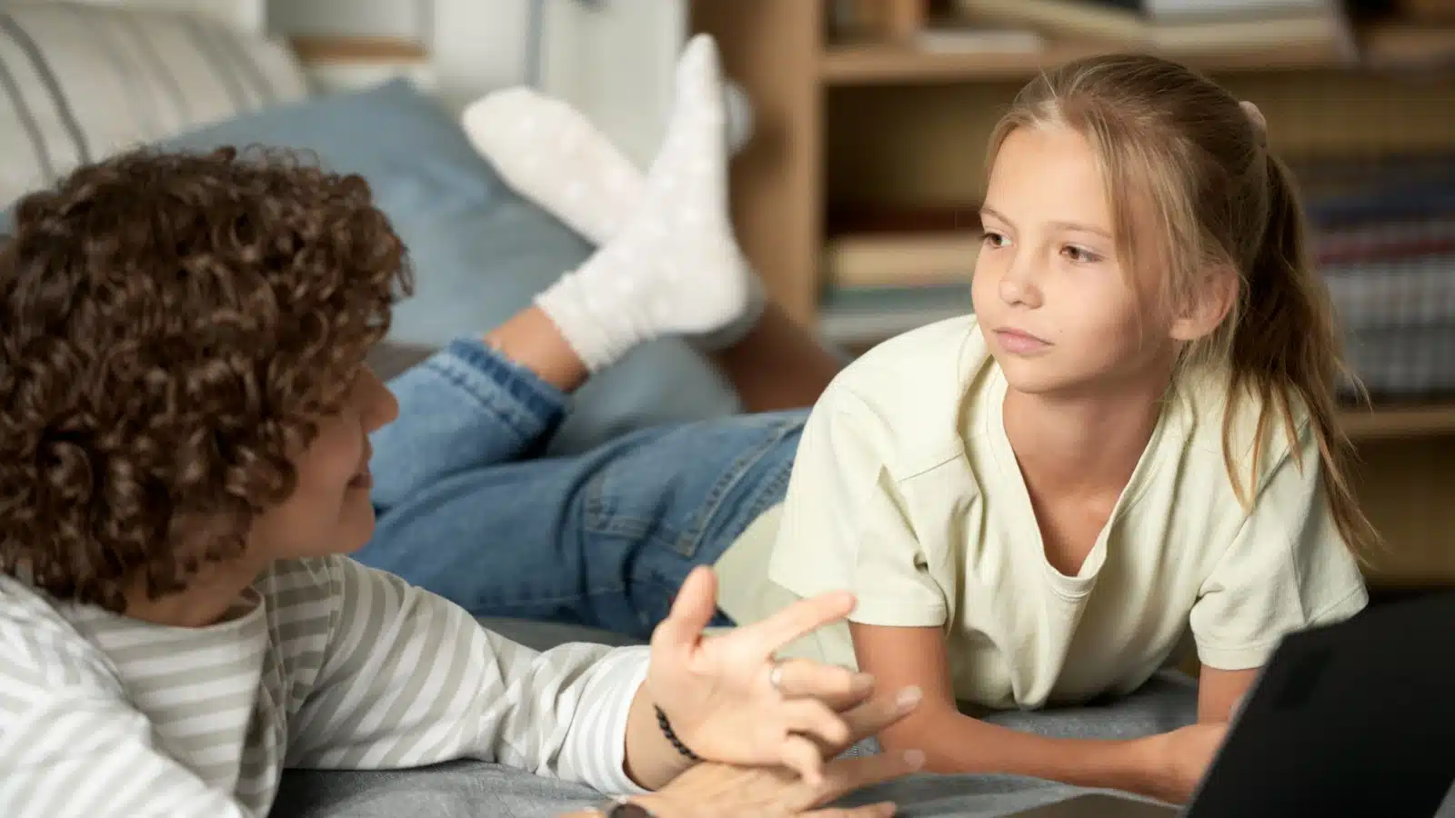 A mom discussing online safety and dangerous content with her pre-teen daughter. 