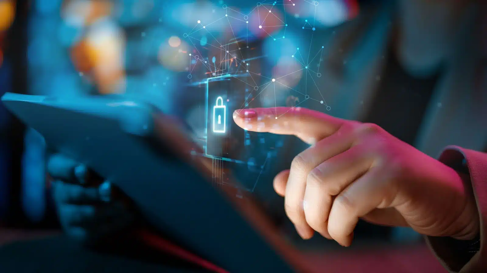 A person logs into a tablet, pressing a lock icon that represents a log in password. 