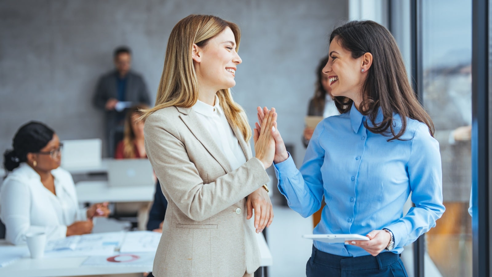 Women working in the office to represent the rise in female breadwinners.