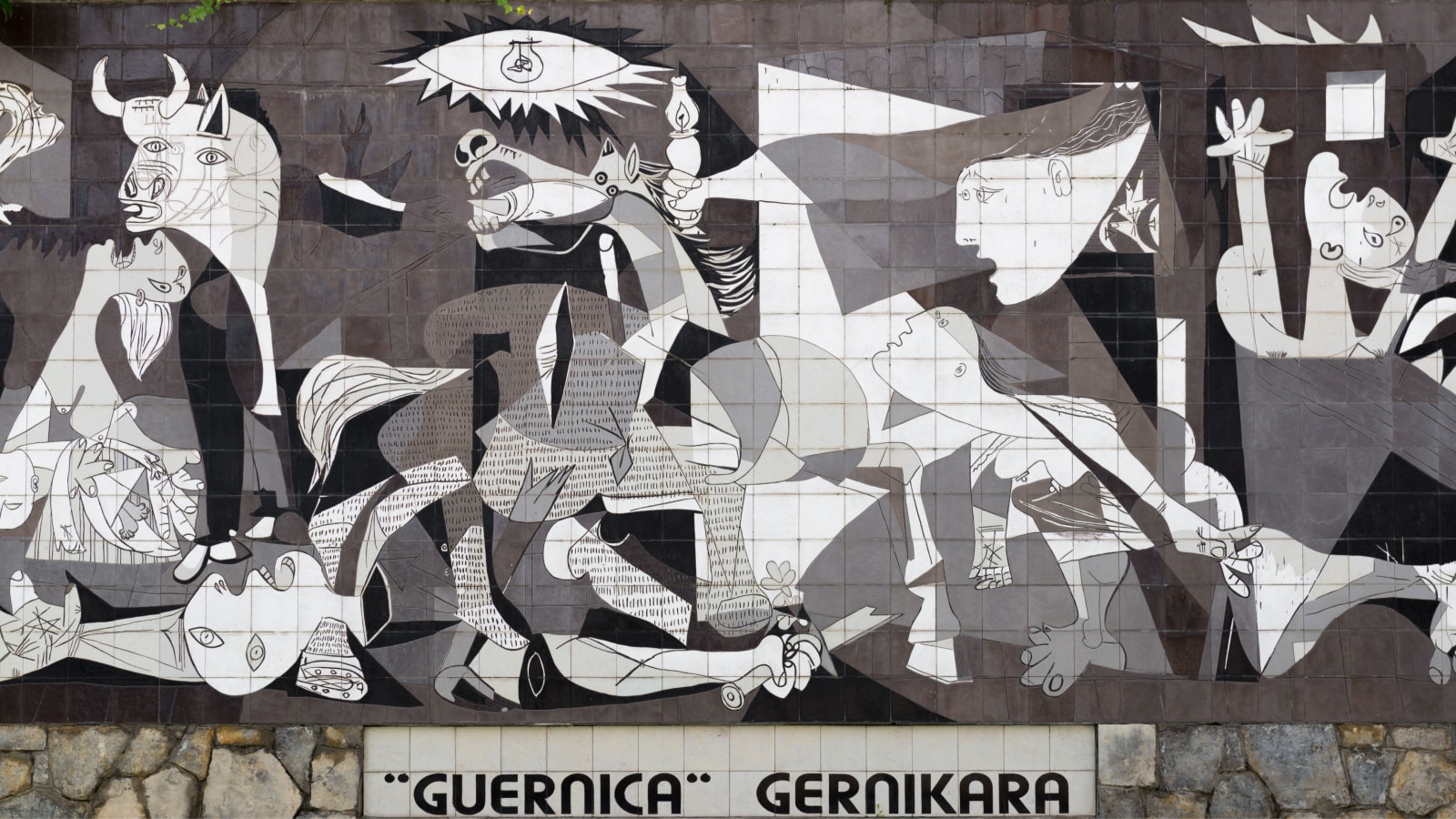 Photo of one of Picasso's most famous paintings: Guernica which depicts the chaos of the Spanish Civil War.
