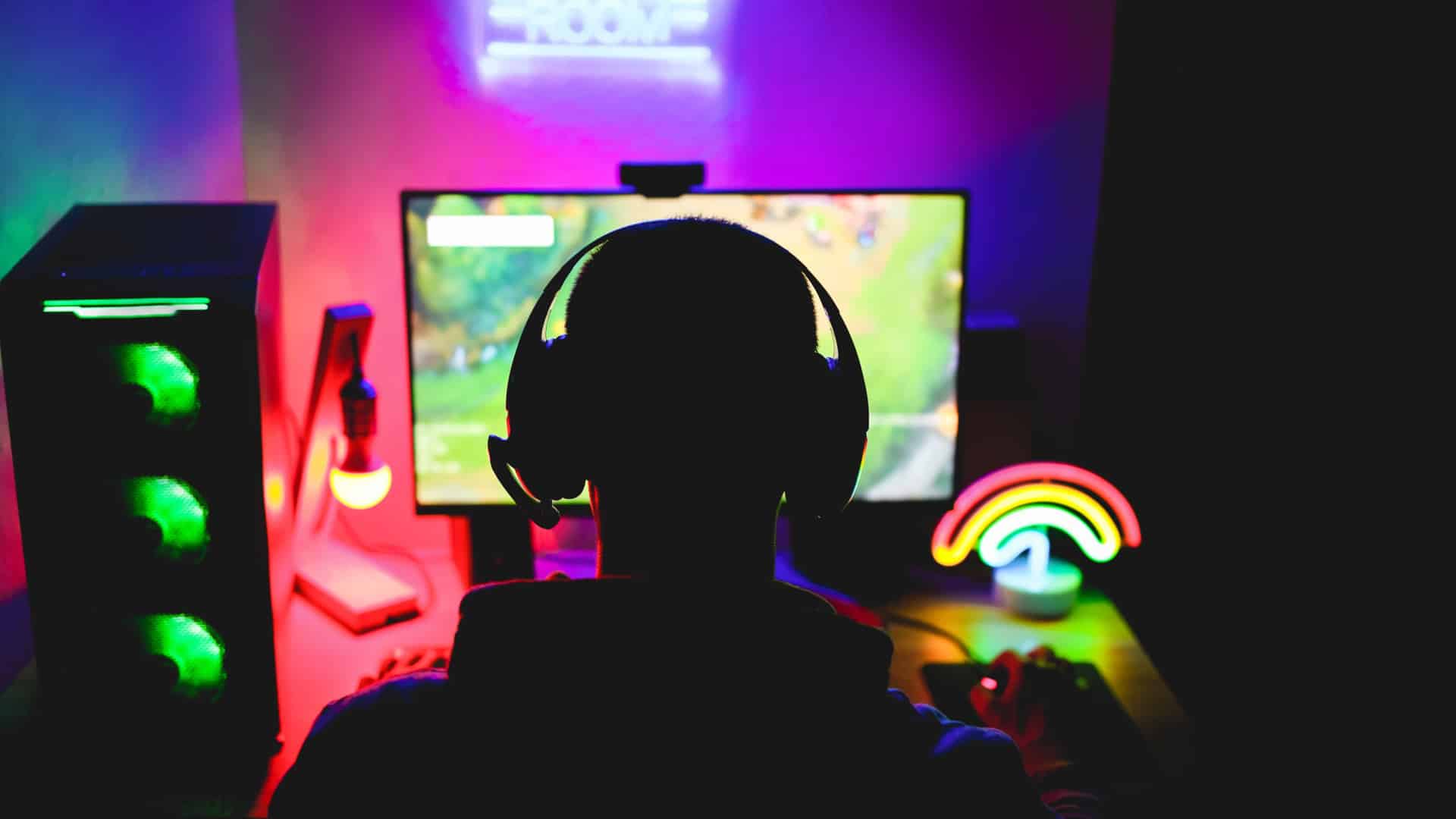 Silhouette of man in front of computer gaming to represent a Twitch affiliate