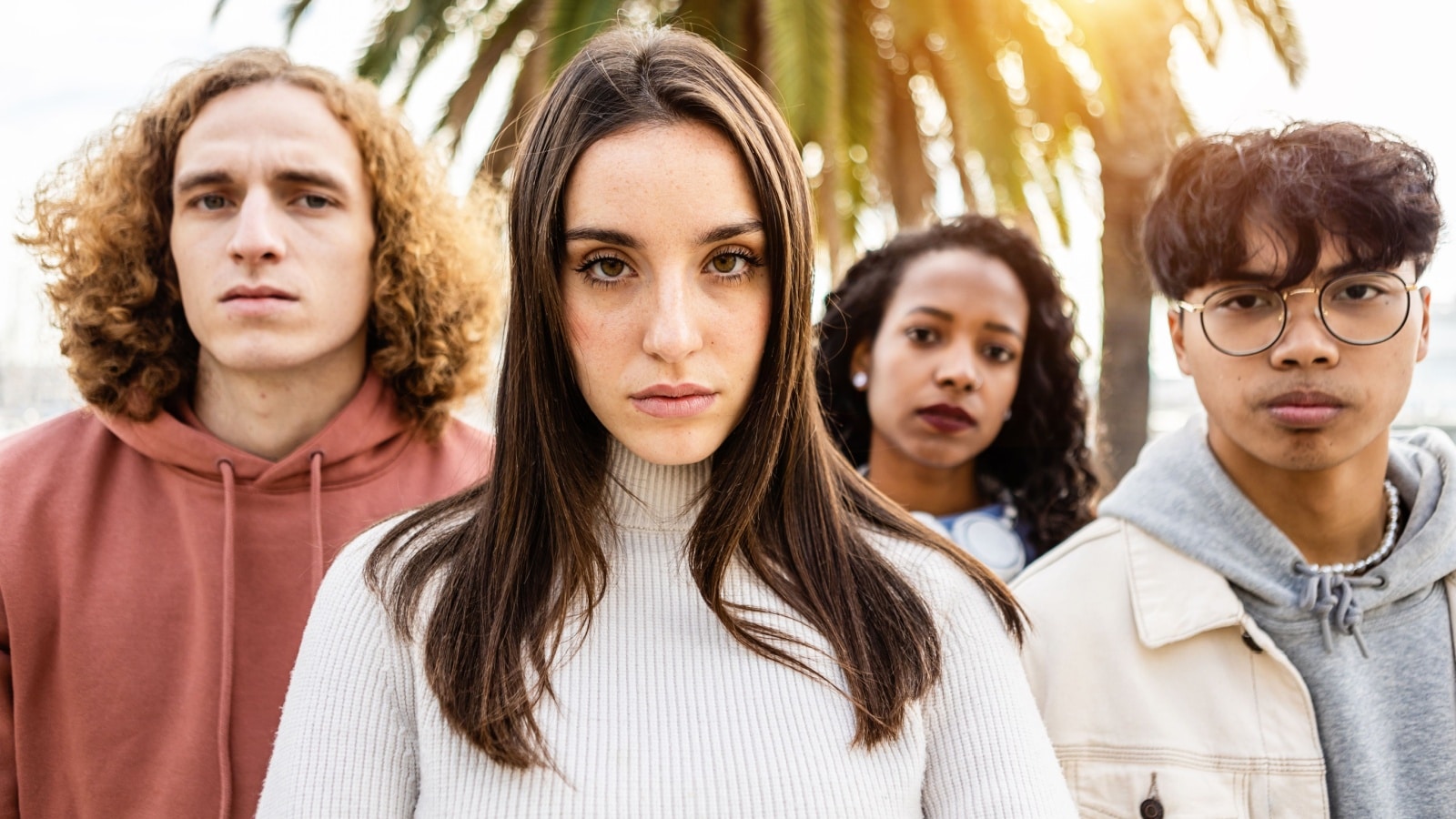 Four unhappy, serious looking young adults staring right into the camera to represent what Millennials want to kill next.