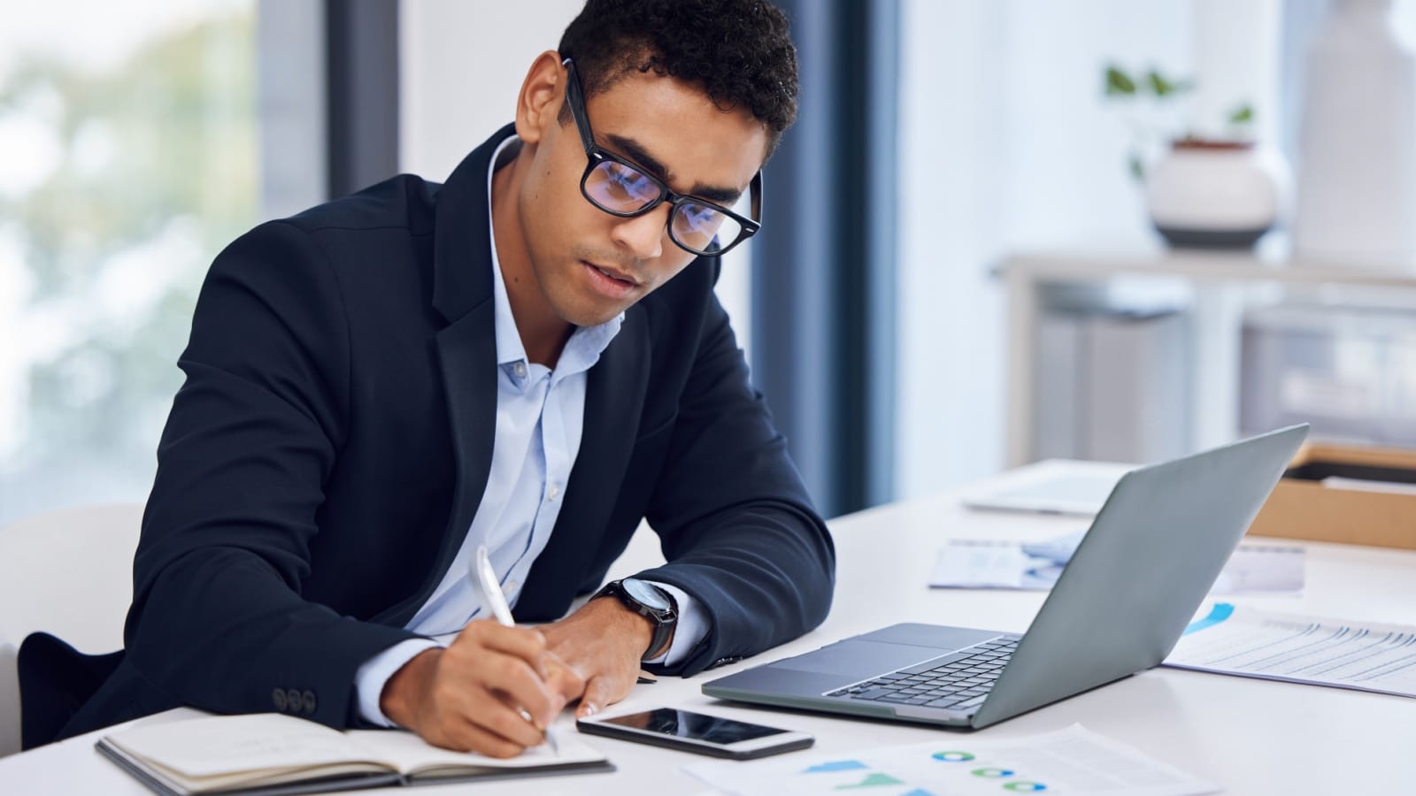 A focused business man getting things done to represent how to be more productive.