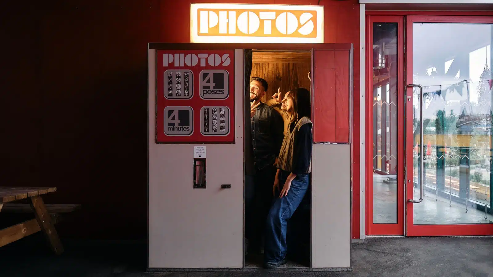 Friends having their picture taken in a photo booth.